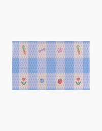 Summer Picnic Dreams by Letters By Shells is a rectangular pastel mat with a blue and beige checkered pattern, featuring small carrot, tulip, strawberry, dog bone, and fish illustrations—ideal for your eco-friendly or reusable Not Paper Towels.
