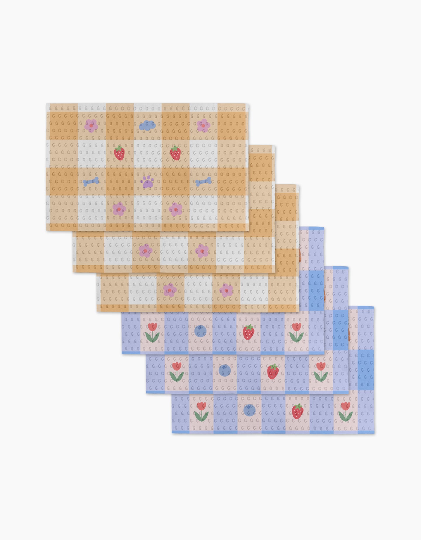 Summer Picnic Dreams by Letters By Shells features six eco-friendly Not Paper Towels with pastel checkerboard patterns and charming flower, strawberry, donut, and fish illustrations—perfect for a stylish, sustainable table setting.