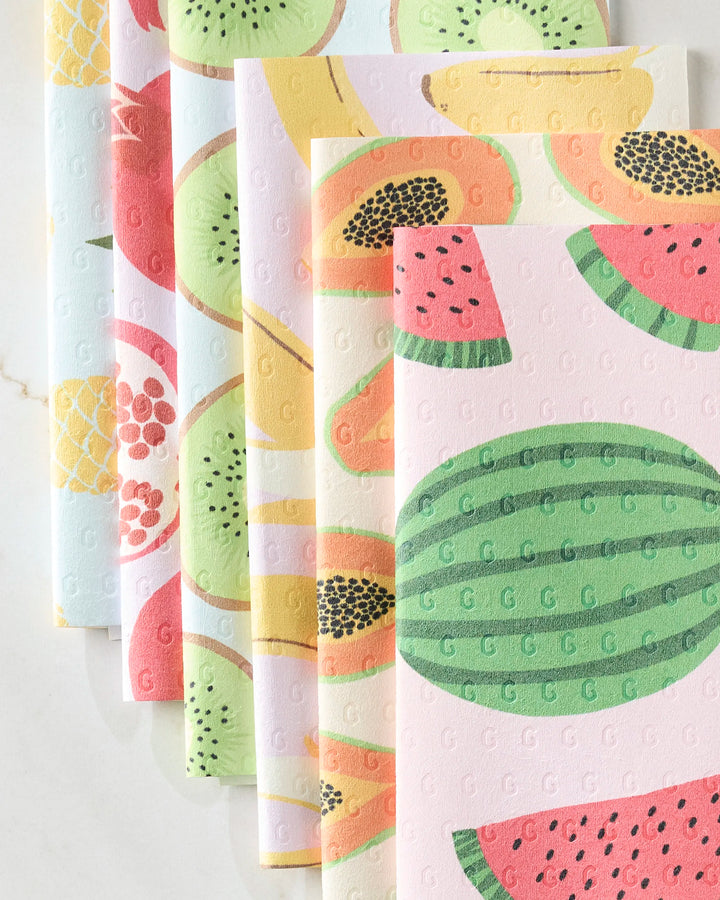 GEOMETRY's Sweet Summer Mix 2 showcases five reusable, eco-friendly paper towels with watermelon, papaya, kiwi, pomegranate, and pineapple patterns. Each towel features embossed G letters and is arranged in a fan shape on a white surface.