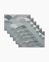 A set of six rectangular Sweet Valley Hills Green placemats by Hufton Studio, featuring a blue, gray, and white abstract wave and leaf pattern—an eco-friendly alternative to kitchen towels for stylish dining.