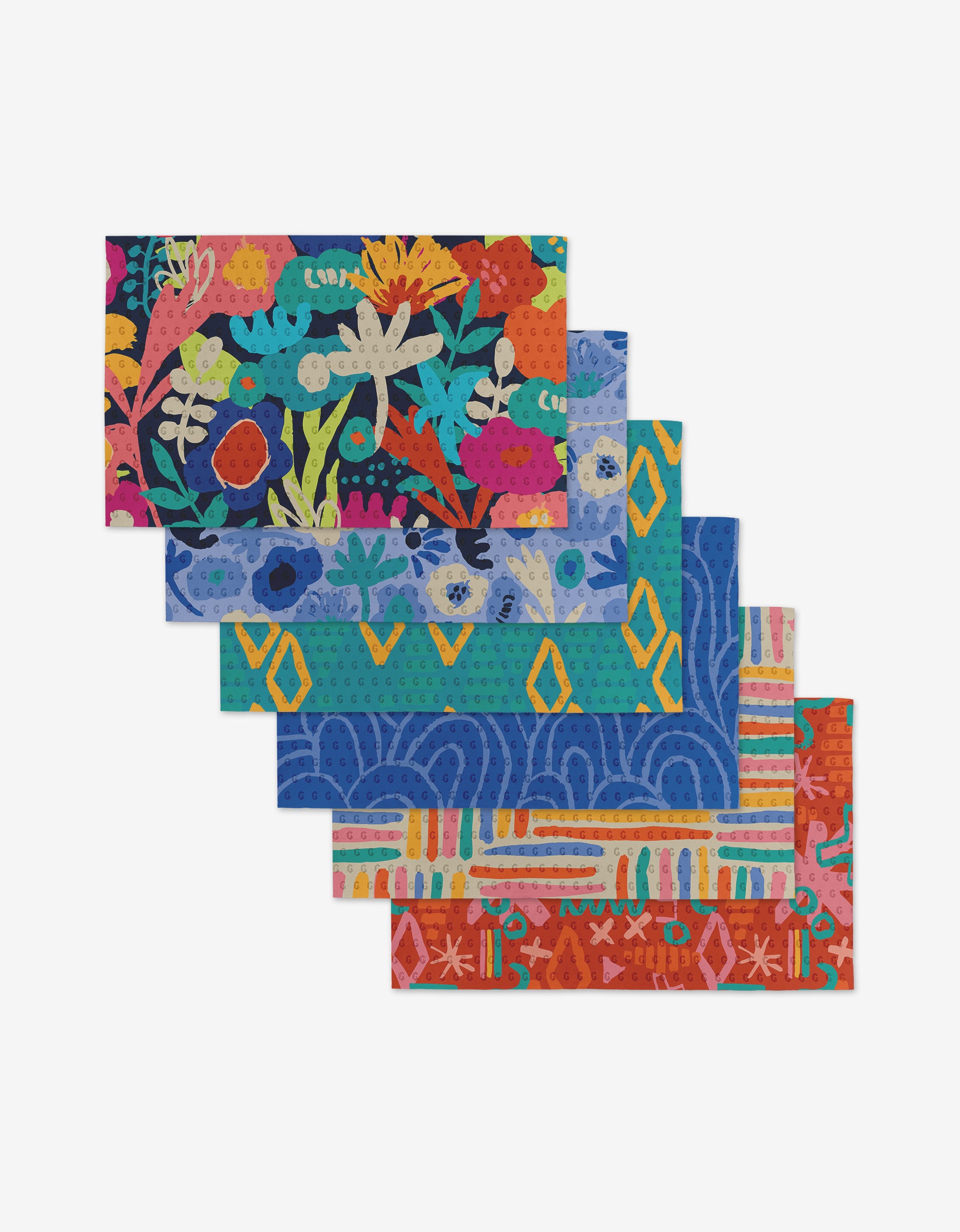 Five vibrant Sareka Unique dishcloths are stacked, each with abstract and floral patterns in blue, orange, yellow, pink, and green—crafted from post-consumer recycled materials.