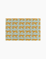 The Walking Cheetah rug by Jasmine Blooms Designs is a light blue rectangular rug with orange cheetahs walking left and decorative swirls—an ideal eco-friendly accent for homes that use reusable paper towels.