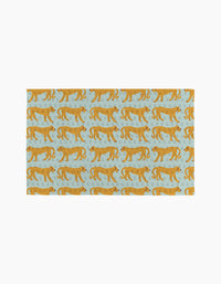 The Walking Cheetah rug by Jasmine Blooms Designs is a light blue rectangular rug with orange cheetahs walking left and decorative swirls—an ideal eco-friendly accent for homes that use reusable paper towels.