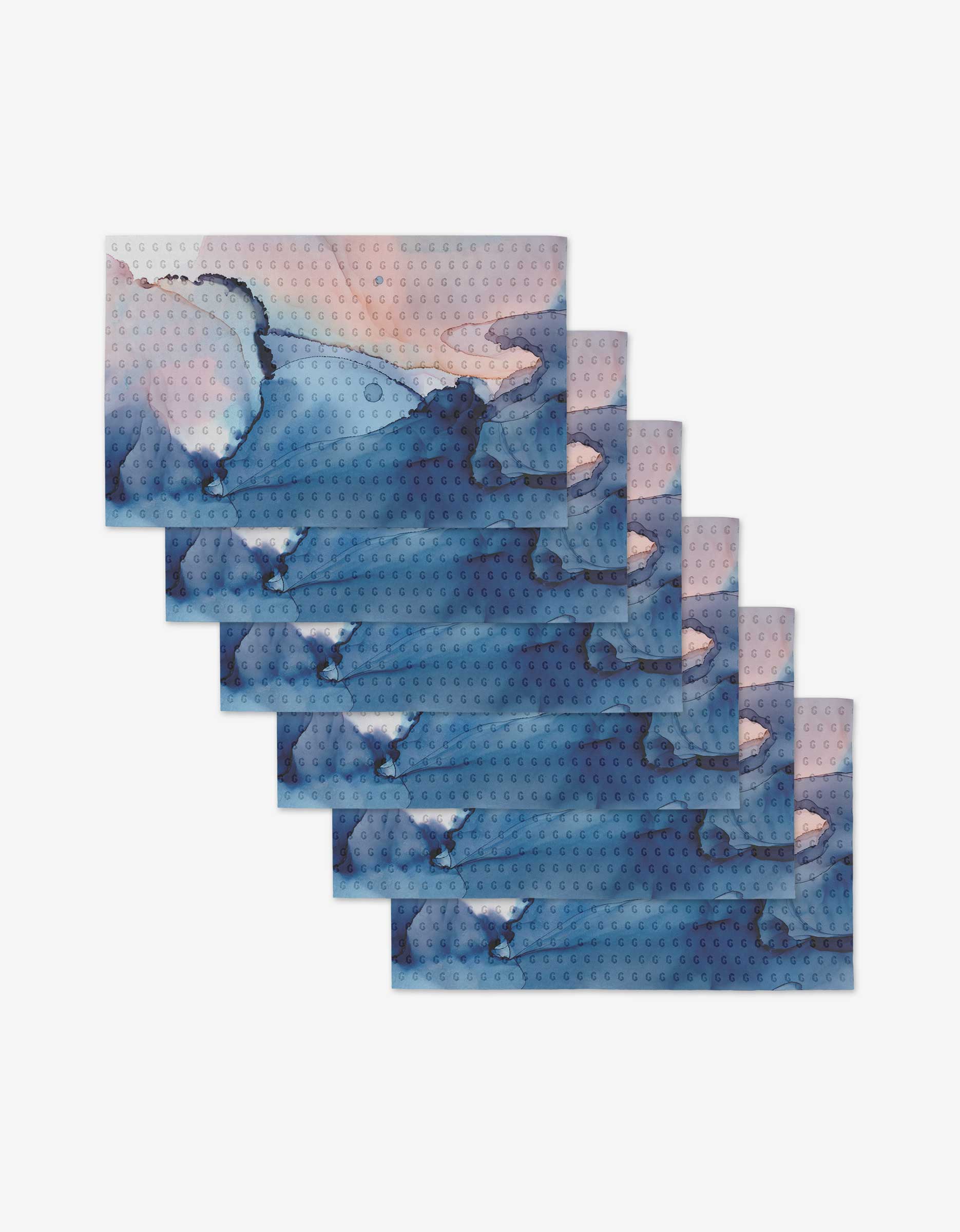 Seven rectangular Water And Ink cards by GEOMETRY overlap in a staggered display, each showcasing abstract blue and pink watercolor art on white, crafted from eco-friendly post-consumer recycled materials.