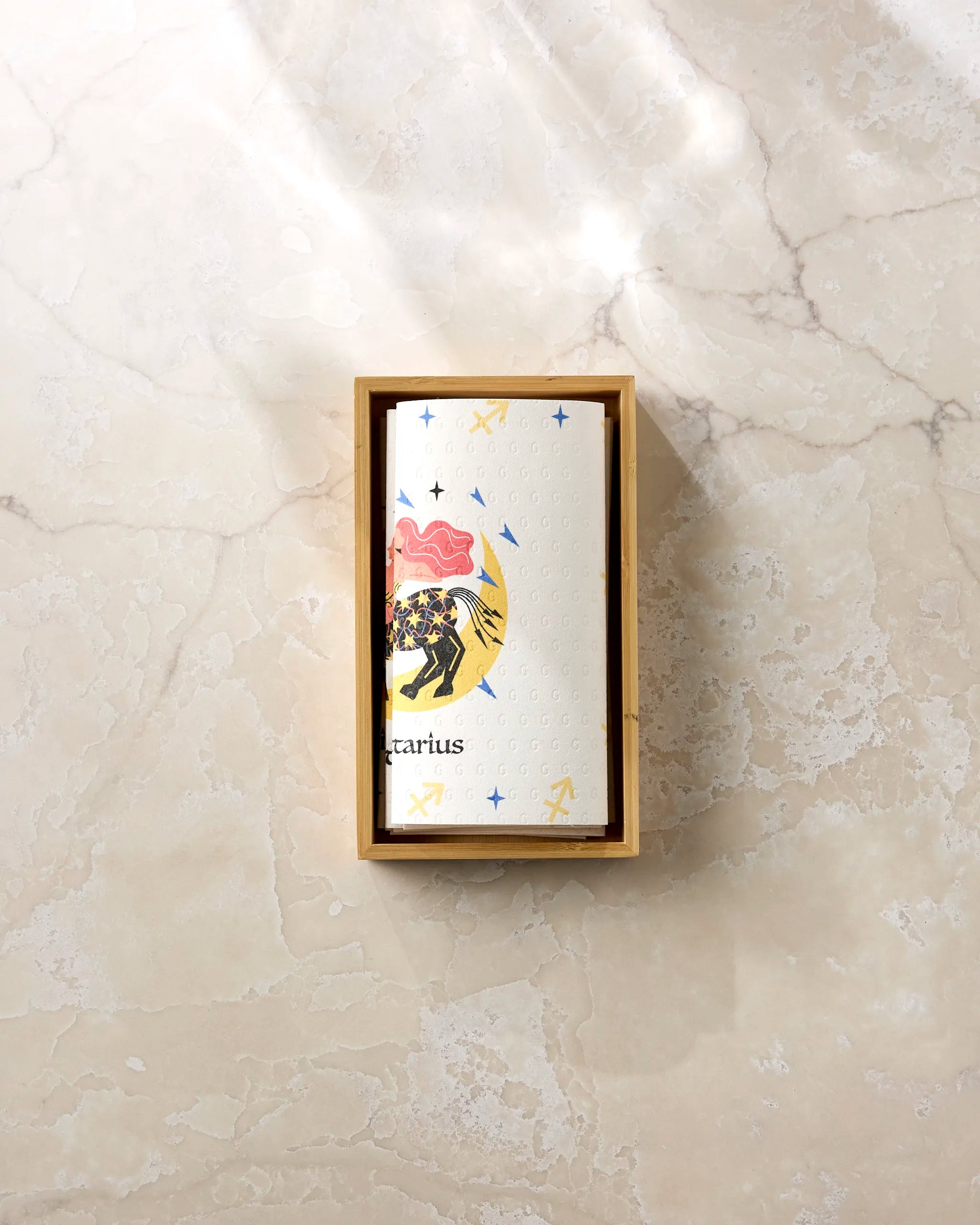 Wild Sagittarius by Heather Zhou is a rectangular wooden box containing a recycled card depicting a centaur, stars, arrows, and a pink cloud on a marbled background—perfect for celebrating the spirit of Sagittarius.