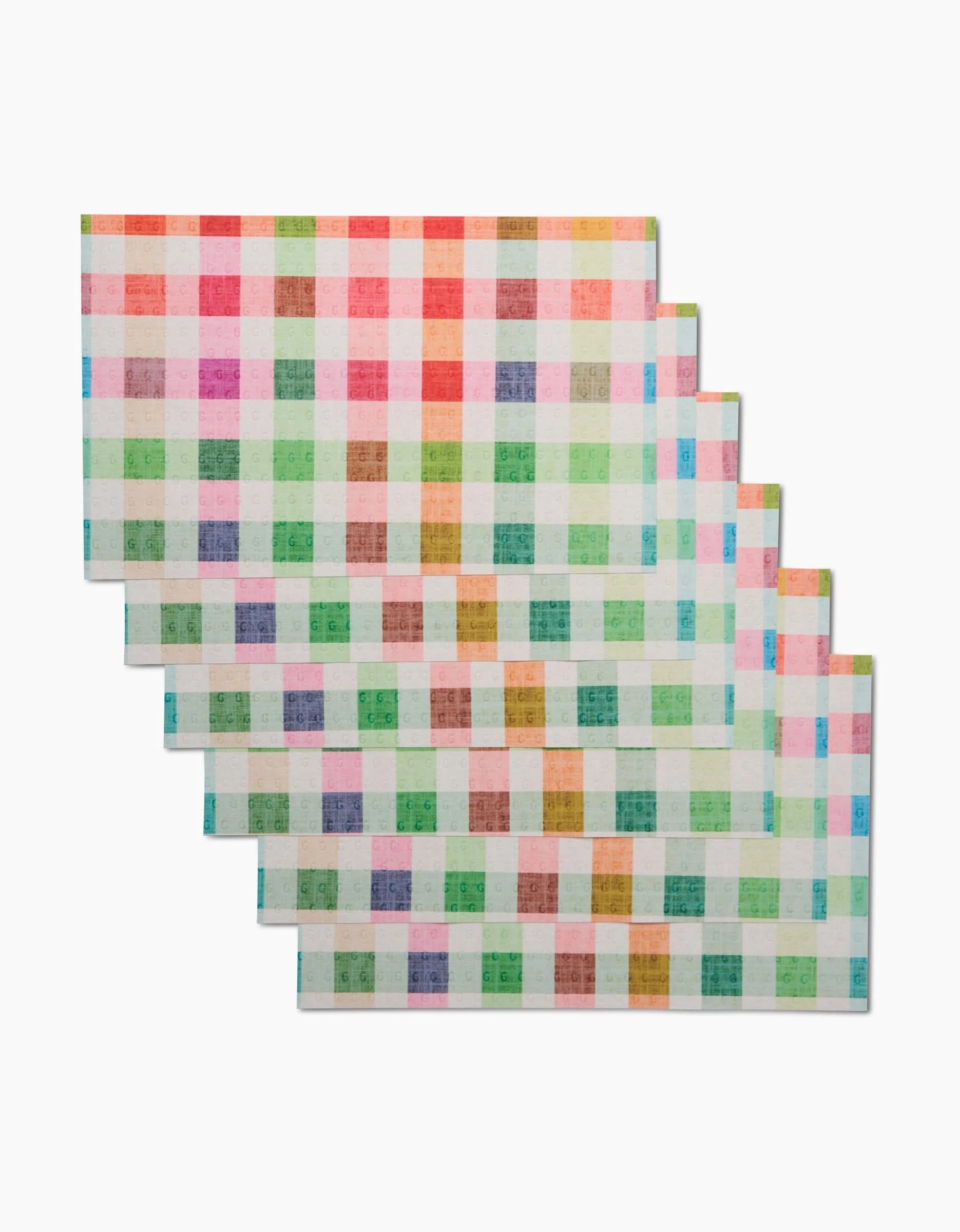Six rectangular Woven Spring Plaid cloths by Pascale Dilger, featuring colorful gingham patterns in red, orange, green, blue, and purple, are stacked with a slight offset—an eco-friendly Not Paper Towel alternative.