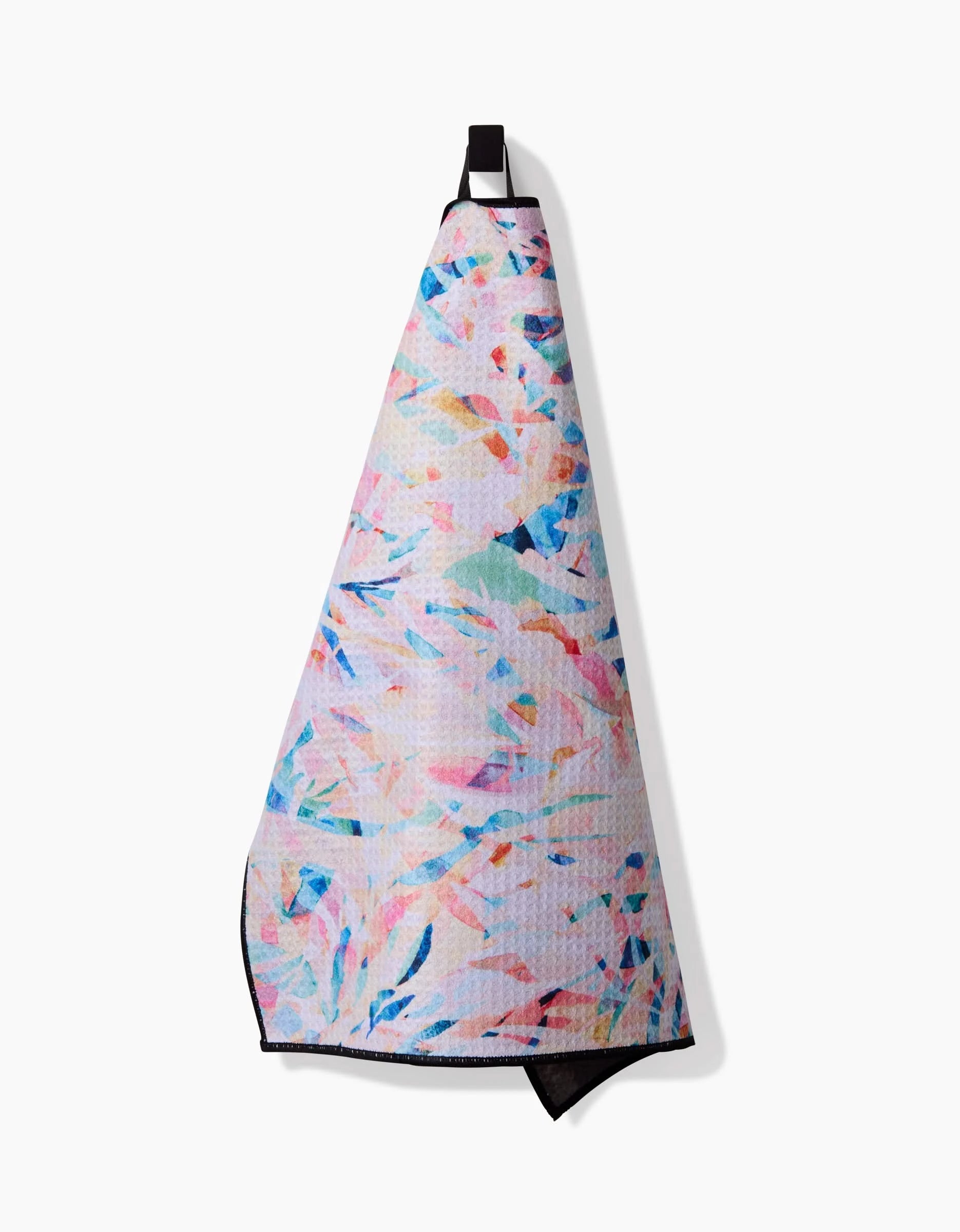 The Rachel Parker Abstract Jungle Paw Towel, featuring pastel abstract brushstrokes on ultra-absorbent Geoweave fabric, hangs by a black loop against a plain white background.