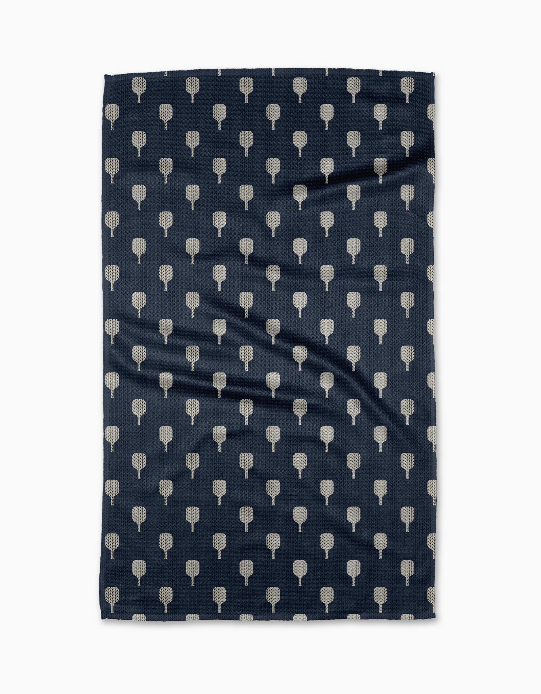 The Modern Dads Mr. Pickler is a dark blue rectangular tea towel made from Geoweave fabric, featuring a repeating pattern of small, light-colored tree icons. It is shown with slight creases on a white background.