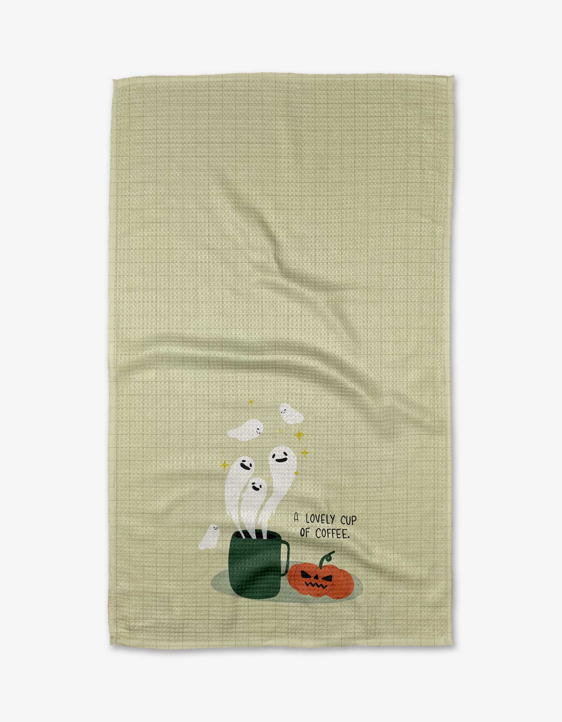 The A Lovely Cup of Coffee tea towel by Allison Olivia Moon is ultra-absorbent, light green with a subtle grid pattern, and shows smiling ghosts from a coffee cup, a jack-o-lantern, and the text “A lovely cup of coffee.”.