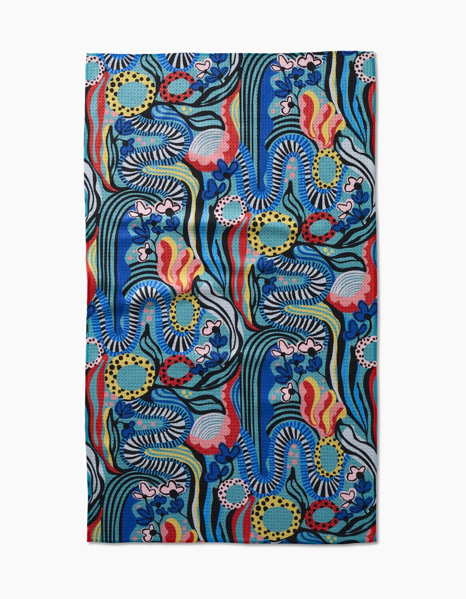 The Abstract Dreams tea towel by Masha Volnova is made from Geoweave fabric and features an abstract design with wavy blue and black lines, red and yellow accents, and leaf- and flower-like shapes on a white background.