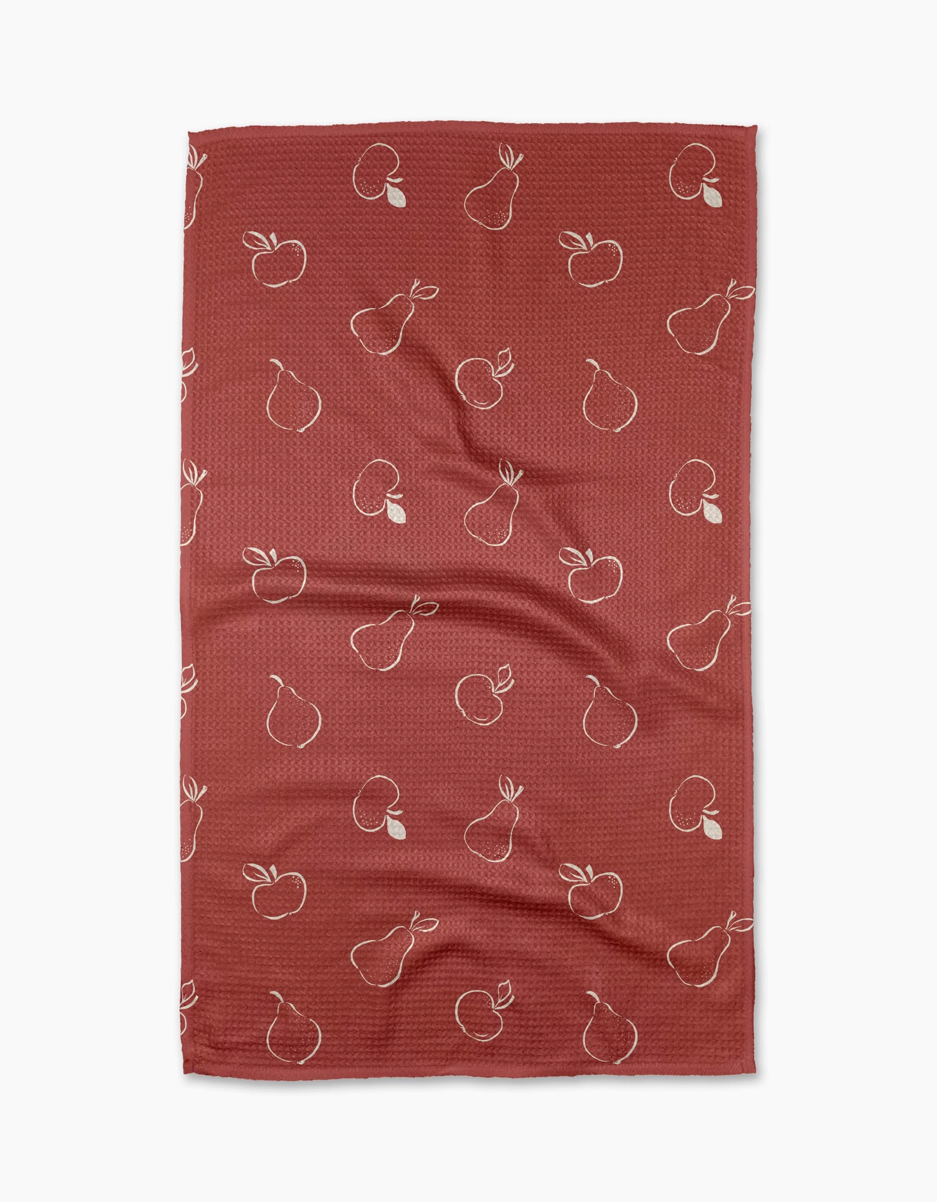 The Linda Fox Apples and Pears recycled kitchen towel features a red background with white outlined apples and pears in a repeating pattern.