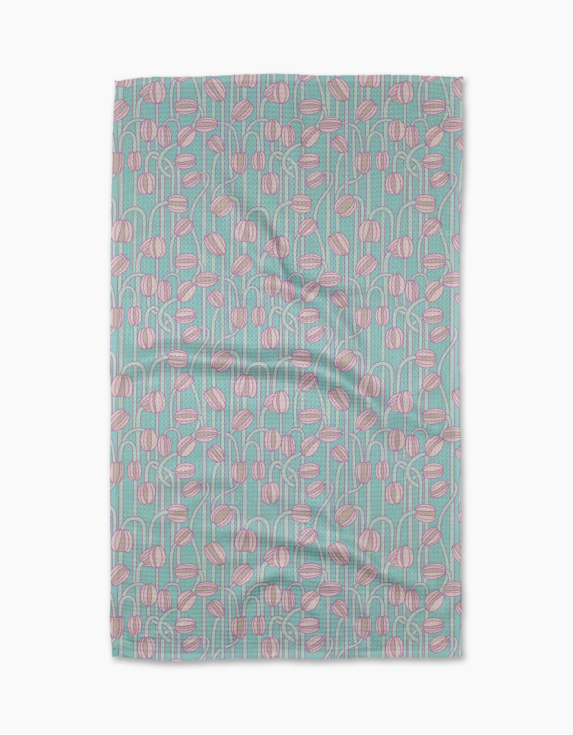 The Aqua Poppy Pods tea towel by Katie OShea is rectangular, crafted from recycled materials, and features pink and white abstract flowers with green stems on a light blue background. The slightly wrinkled fabric lies flat against a white surface.