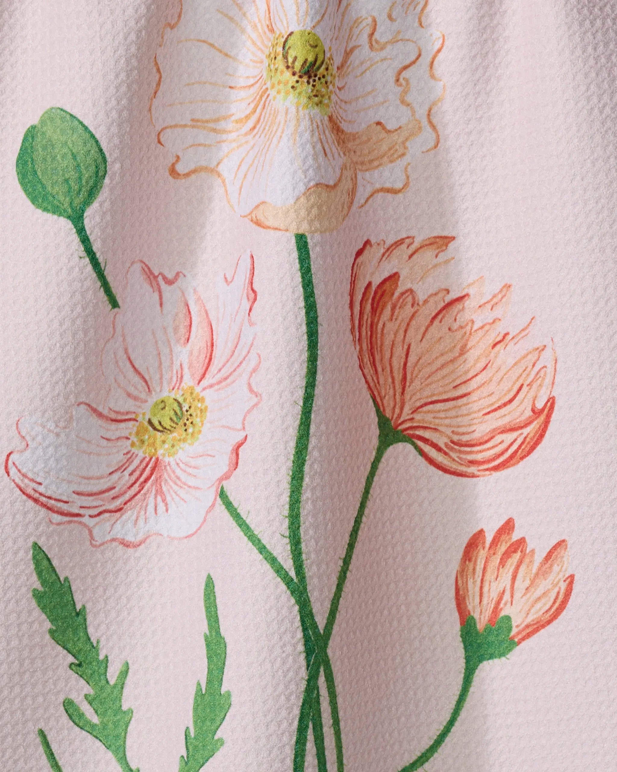 August Poppy by Linda Fox features orange and white poppies with green stems on a textured light pink background, perfect for an eco-friendly kitchen tea towel.