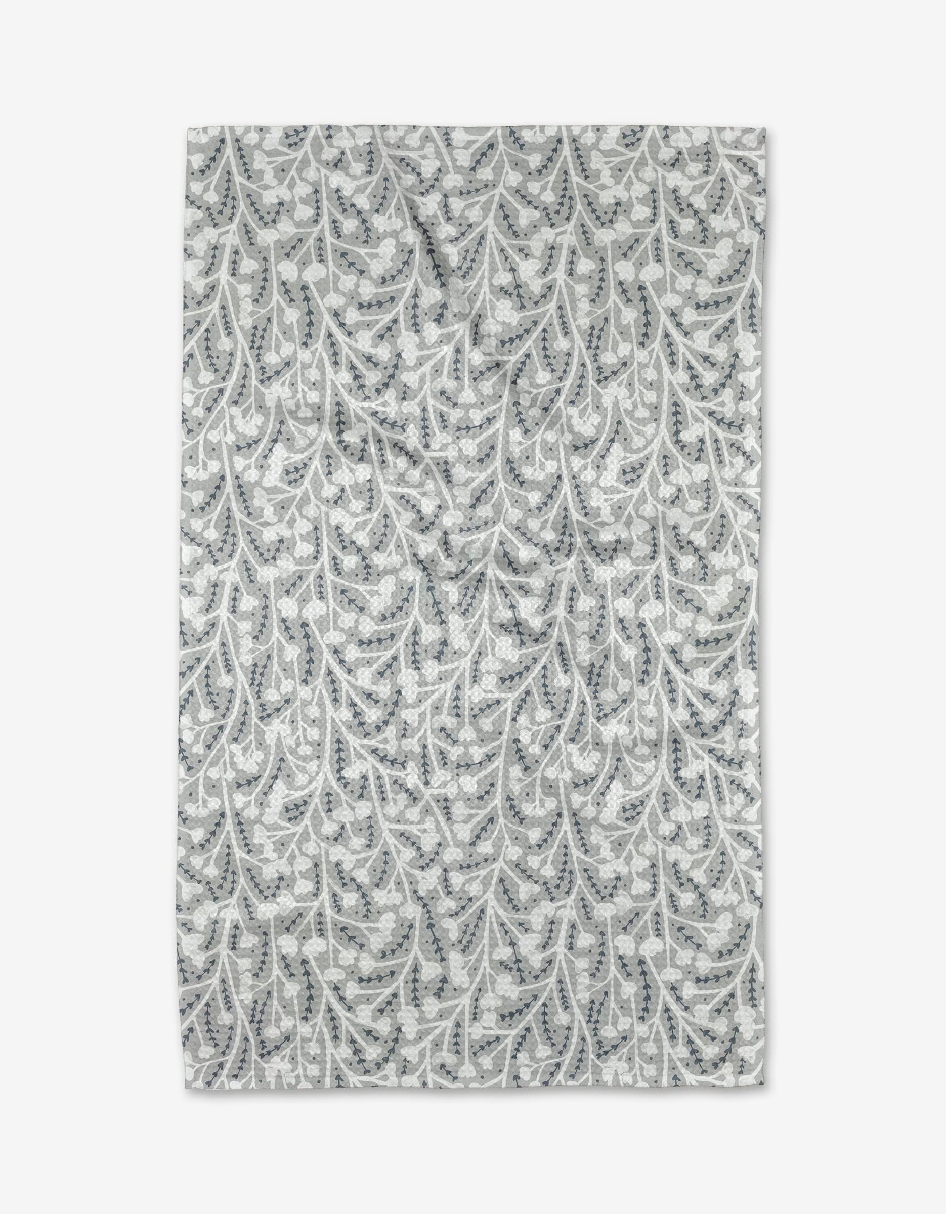 The Babys Breath Geoweave fabric by Katie OShea features a white background with gray and blue leaf and vine patterns, laid flat to showcase its intricate botanical design and ultra-absorbent, eco-friendly qualities.