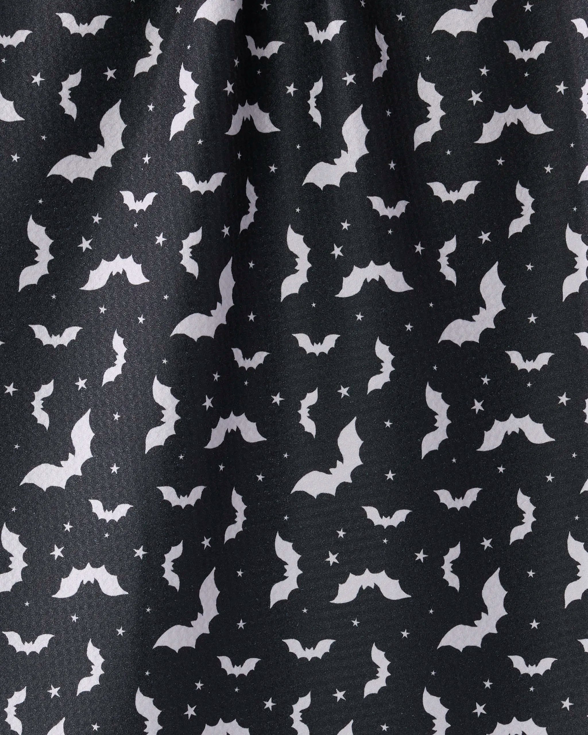 Batty Night by Geometry features black fabric with white bats, stars, and dots—a festive Halloween pattern ideal for an eco-friendly kitchen or tea towel to add seasonal charm to your home.