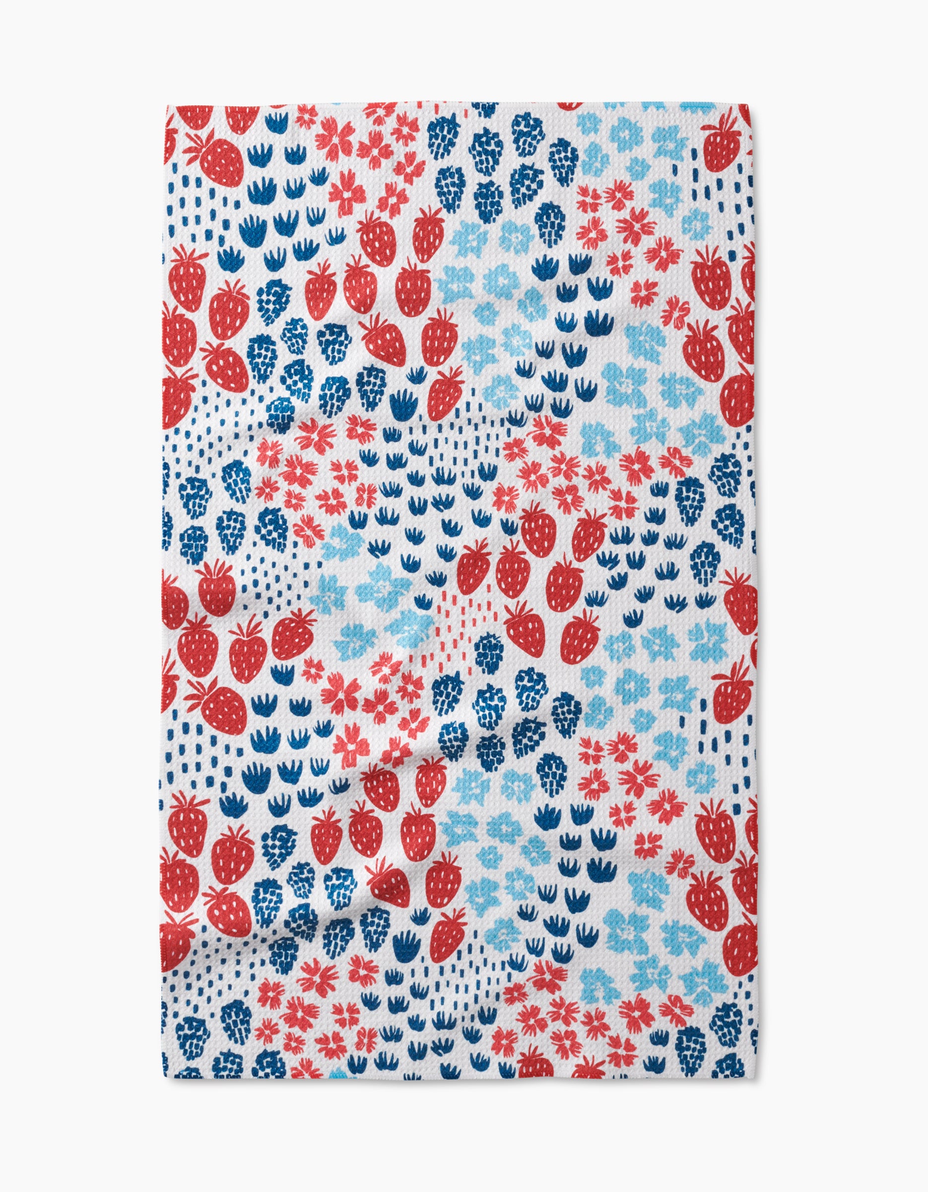 Berry Meadow by Hufton Studio is a rectangular tea towel made from durable Geoweave fabric, featuring a repeating pattern of red strawberries, blue flowers, and blue leaves on a white background.