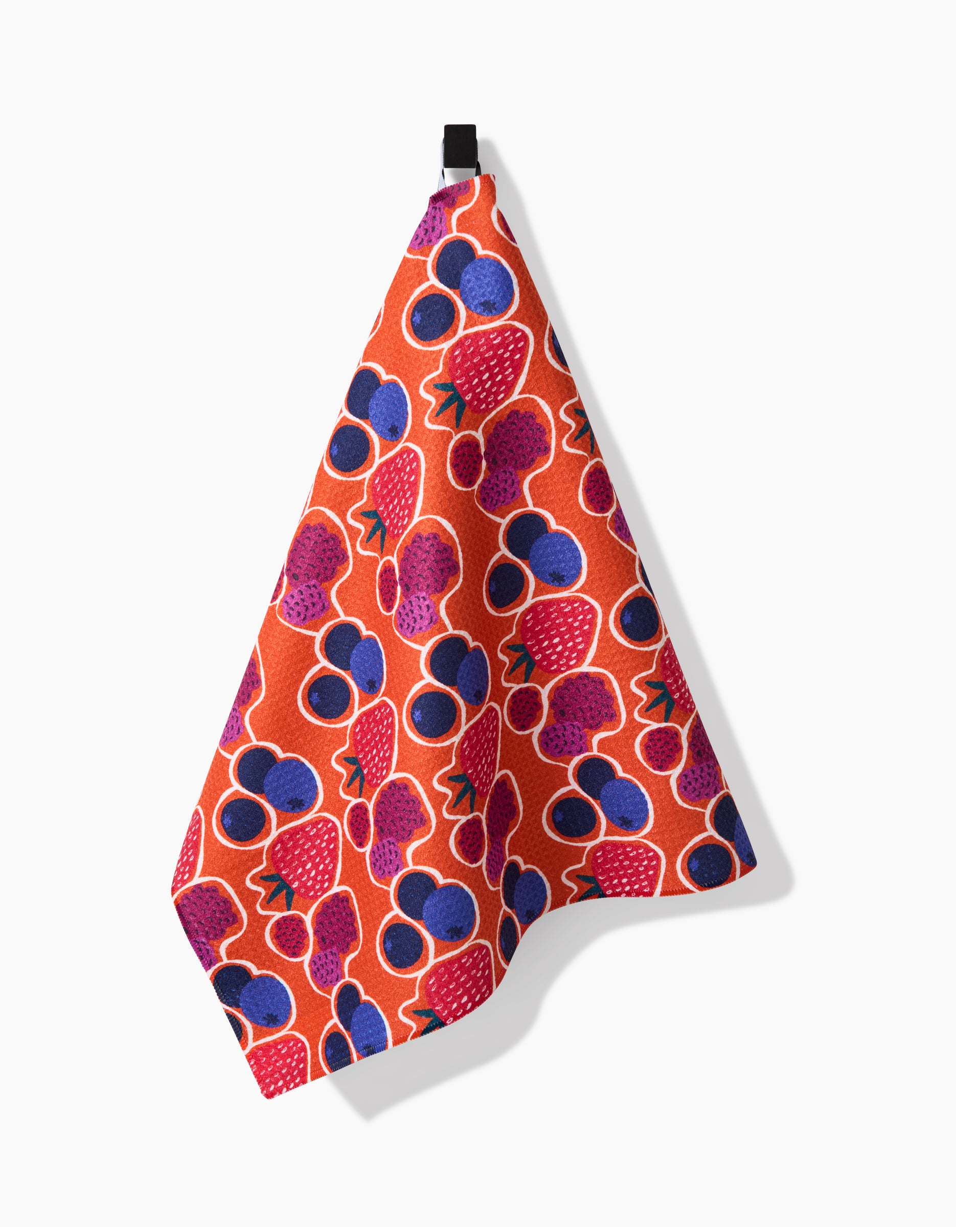 The Lizzie Clark Berrylicious tea towel showcases a vibrant pattern of strawberries, blueberries, and berries on soft, absorbent Geoweave fabric with a handy black loop for hanging.