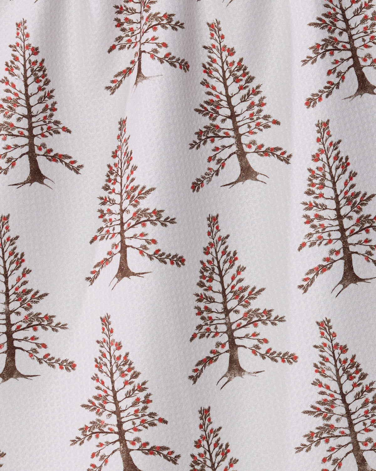 Berrywood by Geometry is a white fabric tea towel featuring a repeated pattern of stylized trees, each with brown trunks and branches adorned with small red berries. Made from recycled materials, this ultra-absorbent towel showcases evenly spaced trees arranged in diagonal rows.