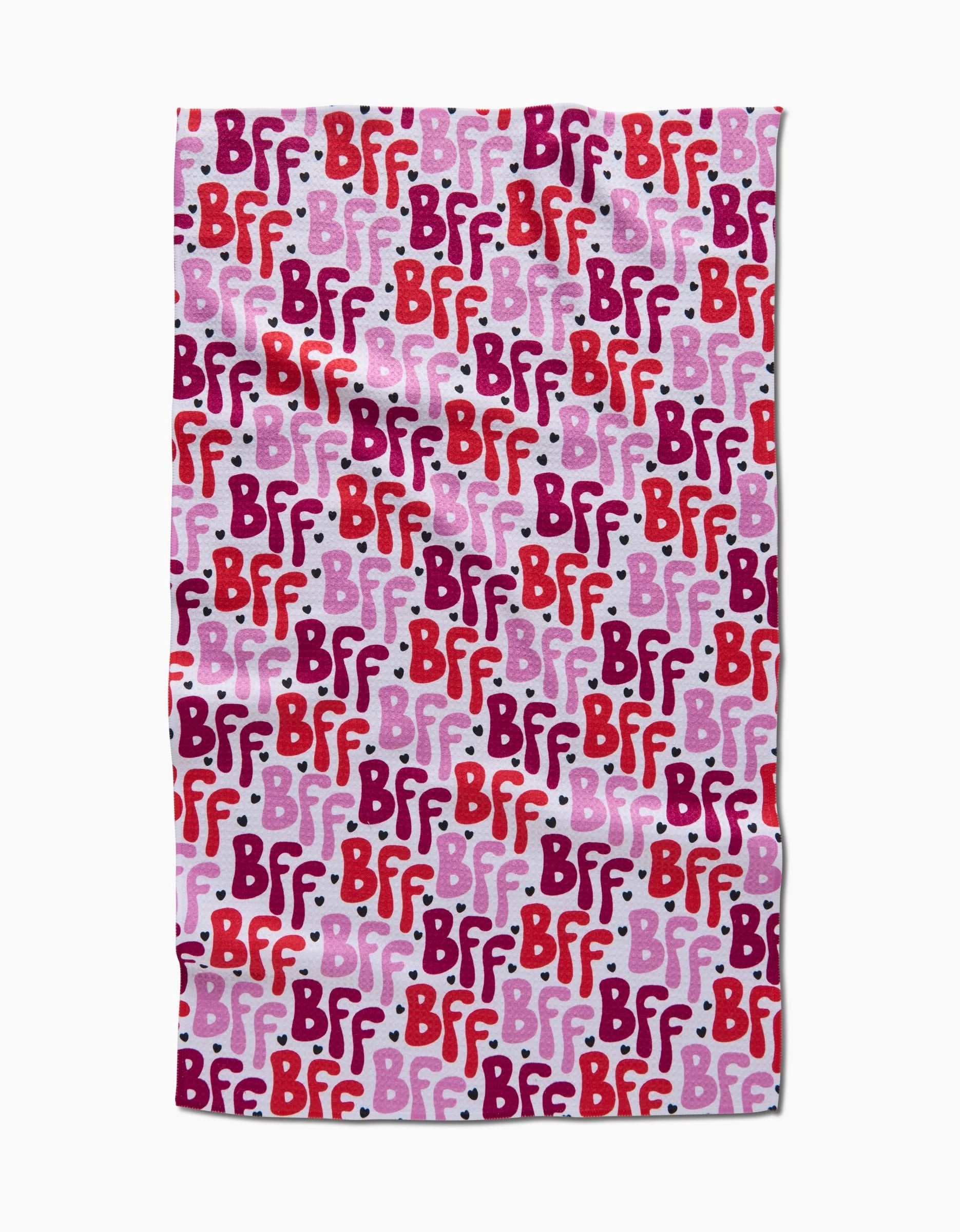 The Best Friends Forever blanket by Hufton Studio features a repeating BFF pattern in red, pink, and purple text on a light pink background with white dots, styled like a charming tea towel for cozy moments.