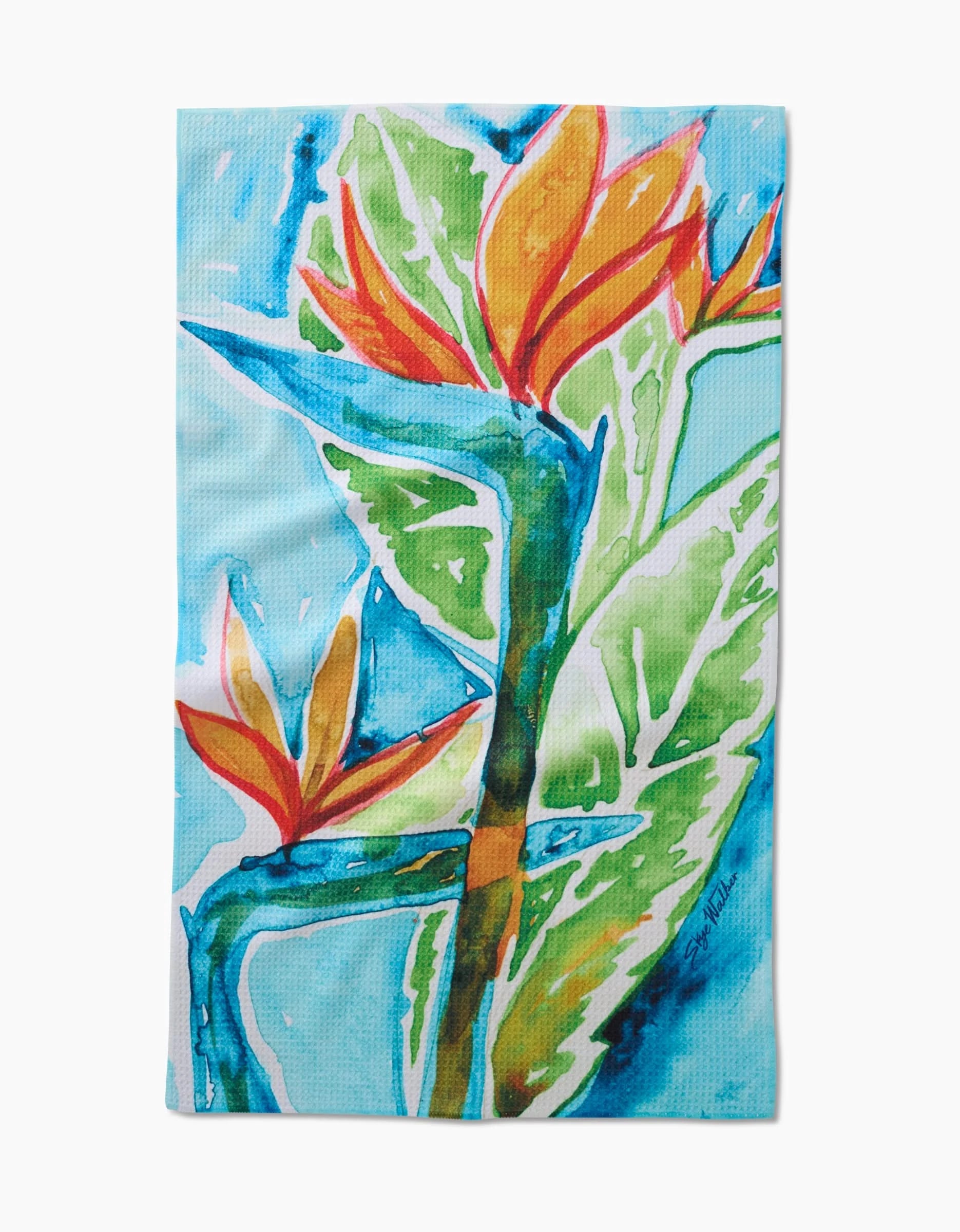 The Bird Of Paradise Tea Towel by Skye Walker features a watercolor-style print of two vibrant bird of paradise flowers with orange and red petals, green leaves, and a blue background on ultra-absorbent Geoweave™ fabric.
