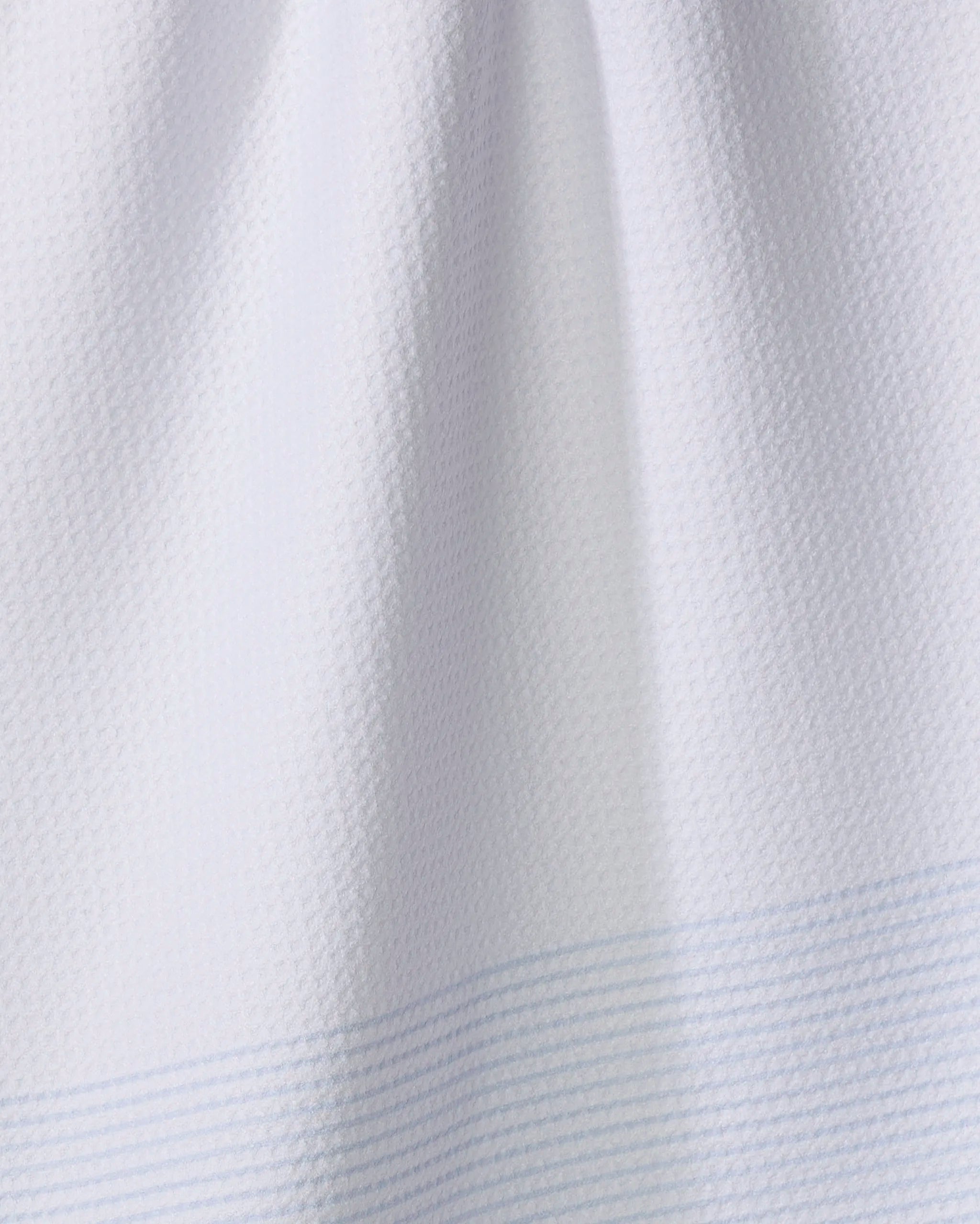 Close-up of The Buy Guide’s Blank Space - Light Blue: an ultra-absorbent, soft white fabric with subtle texture and faint light blue horizontal lines—perfect for tea towels.