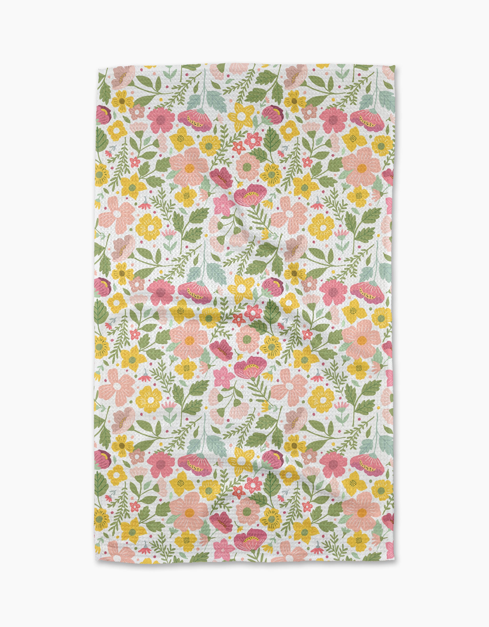 Blooming Days by Cottonflower Studio is a rectangular recycled kitchen towel with a vibrant, dense floral print—pink, yellow, and orange flowers with green leaves on white—covering the entire fabric.