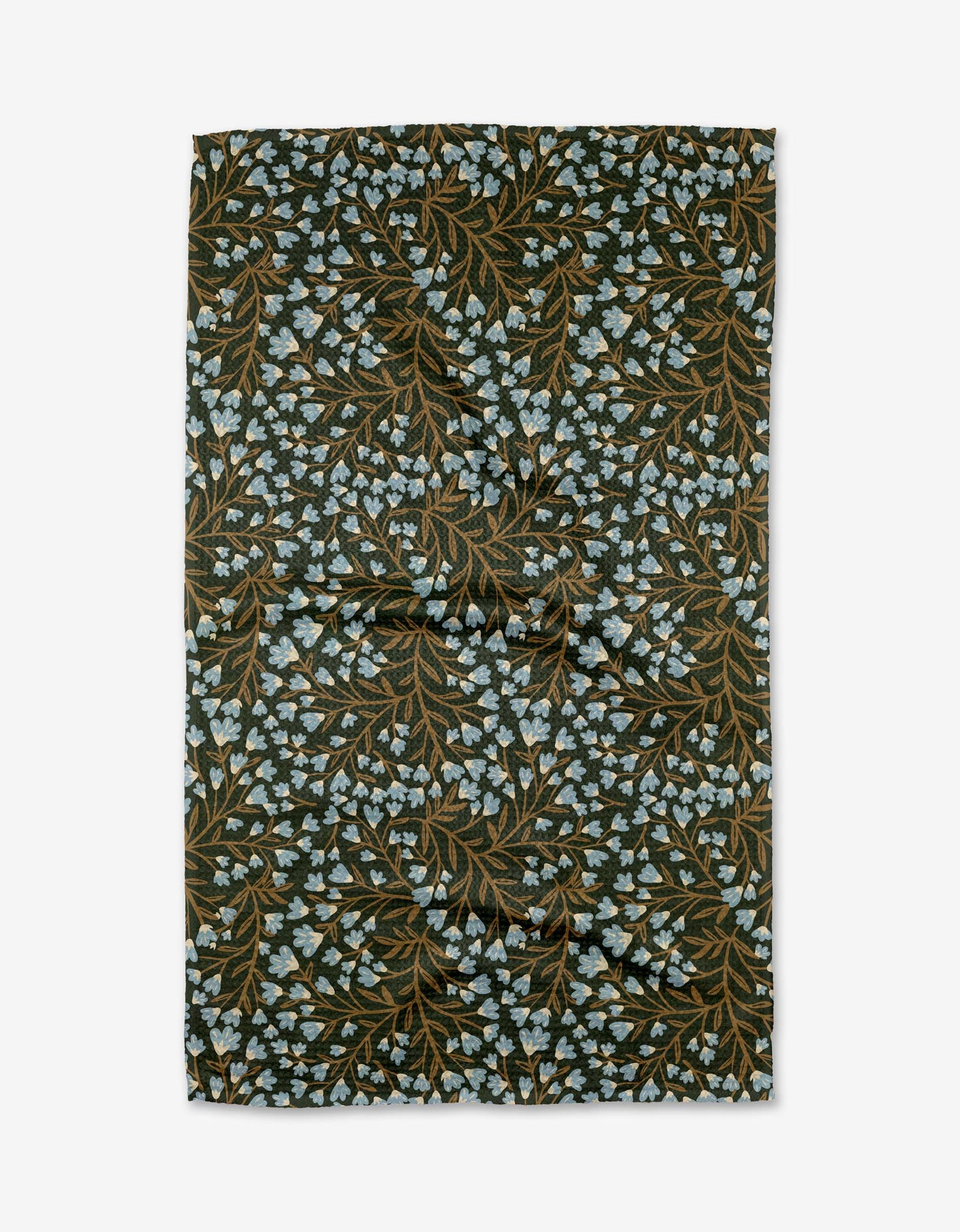 The Bluewood Garden tea towel by Danelys Sidron features a dark background with brown leaves and light blue floral clusters in a botanical pattern, crafted from recycled materials.