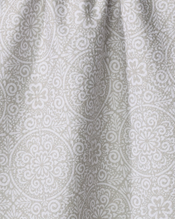 Close-up of the Kris Ruff Boho Medallion dish towel, crafted from absorbent light gray fabric and adorned with a detailed white floral and geometric mandala pattern. Soft texture and gentle folds add subtle shadows to the surface.
