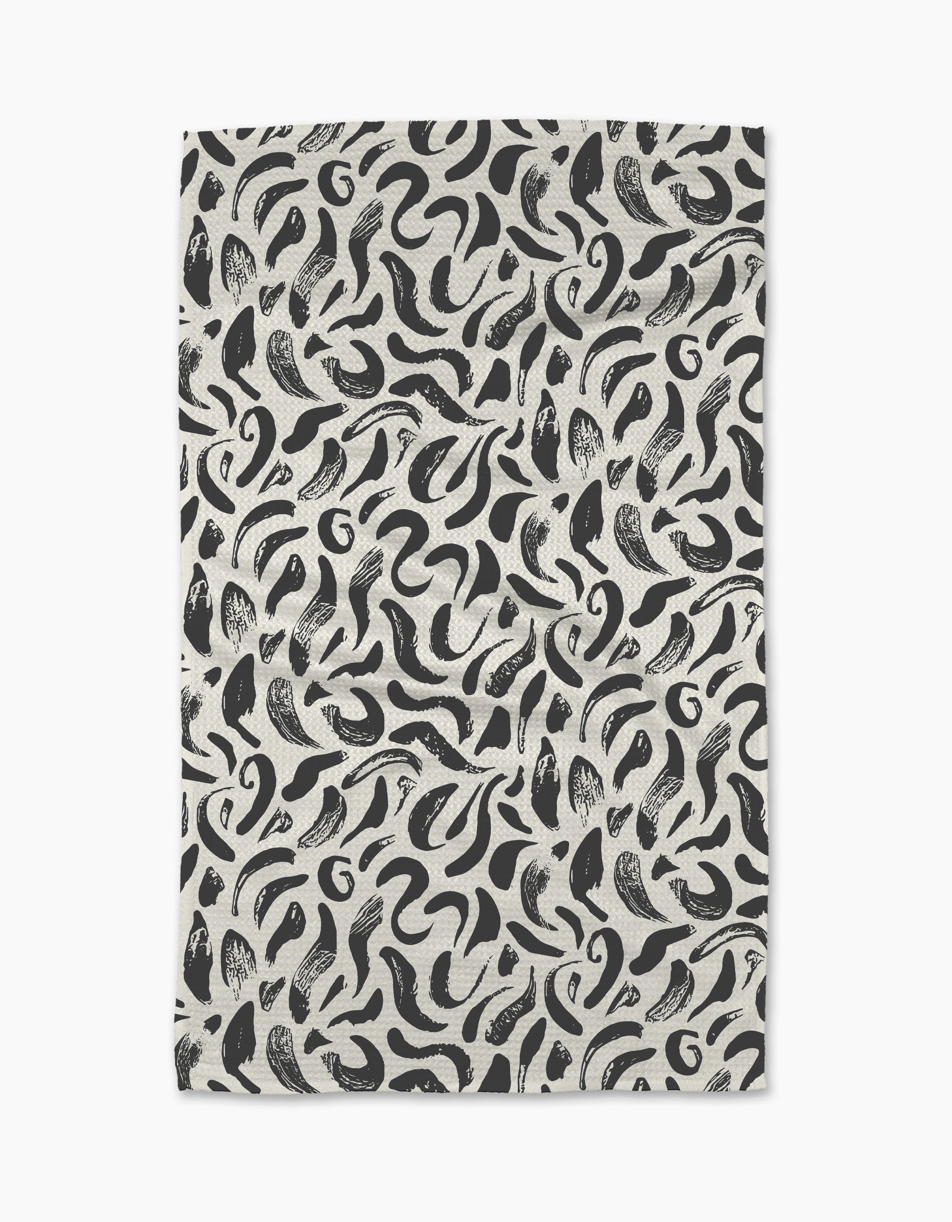The Brush Strokes Swirls tea towel by Sarah Daugherty features a black and white abstract pattern on an off-white background. Made from recycled materials, it offers a stylish and sustainable choice for your kitchen.