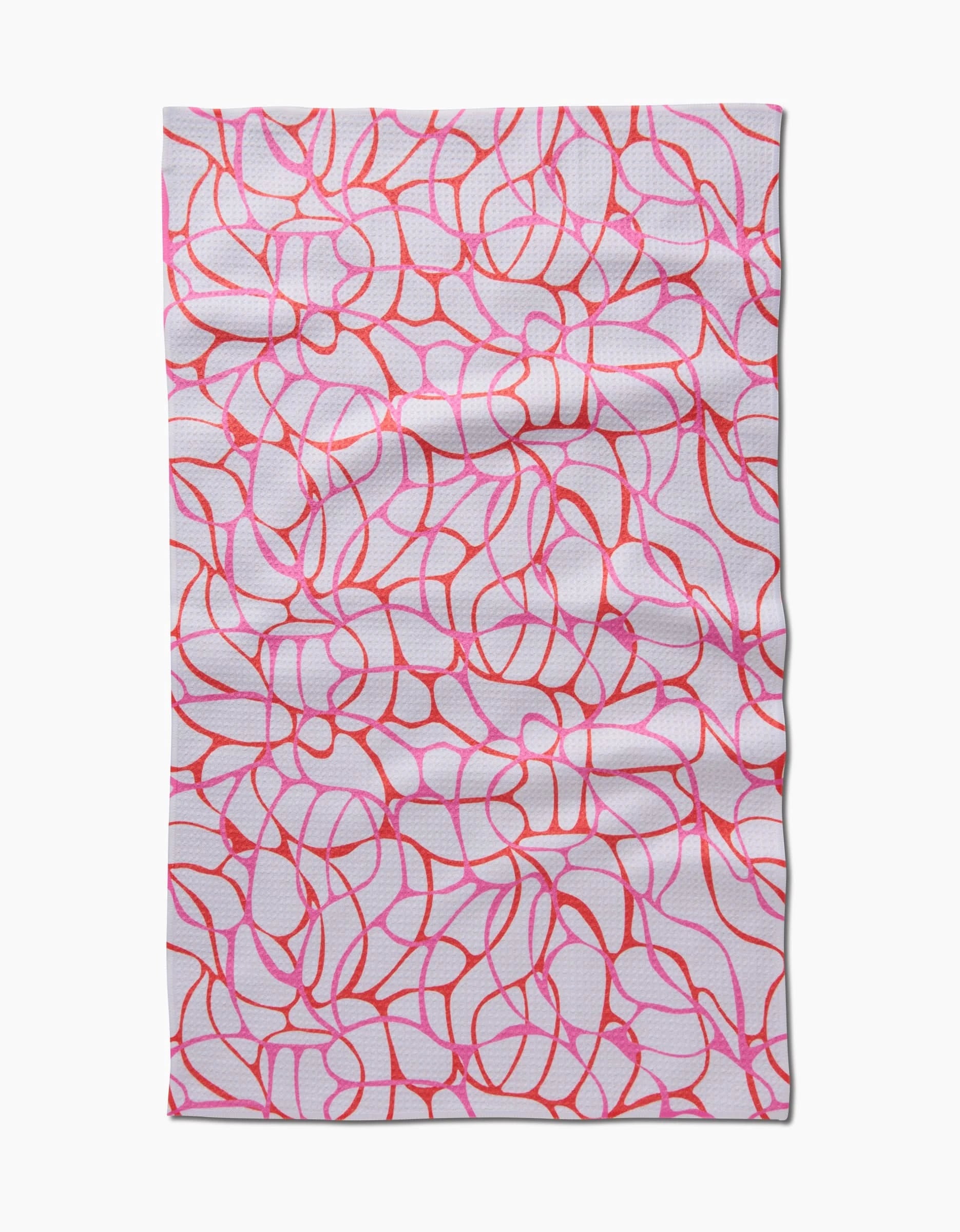 The Bubble Abstract Tea Towel by Rachel Parker features an abstract design with intersecting, curvy red and pink lines on white Geoweave fabric, creating an organic look with a slightly wrinkled texture.