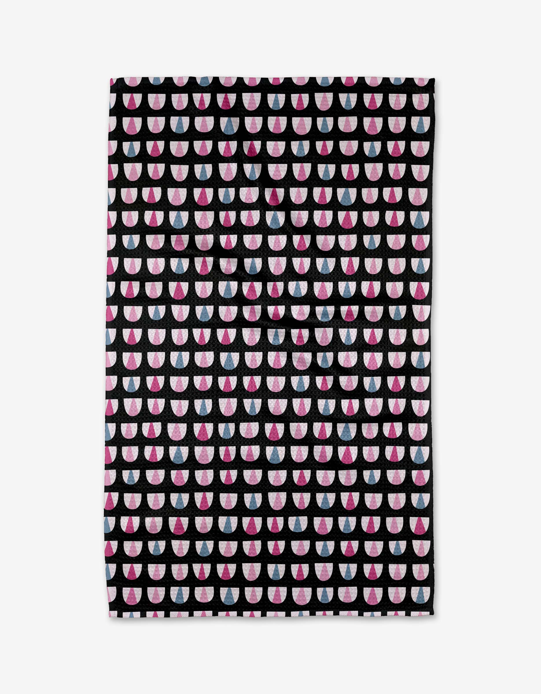 The Bug Boogie tea towel by Anette Heiberg is made from ultra-absorbent Geoweave fabric and displays neat rows of pink, white, and red half circles on a black background.
