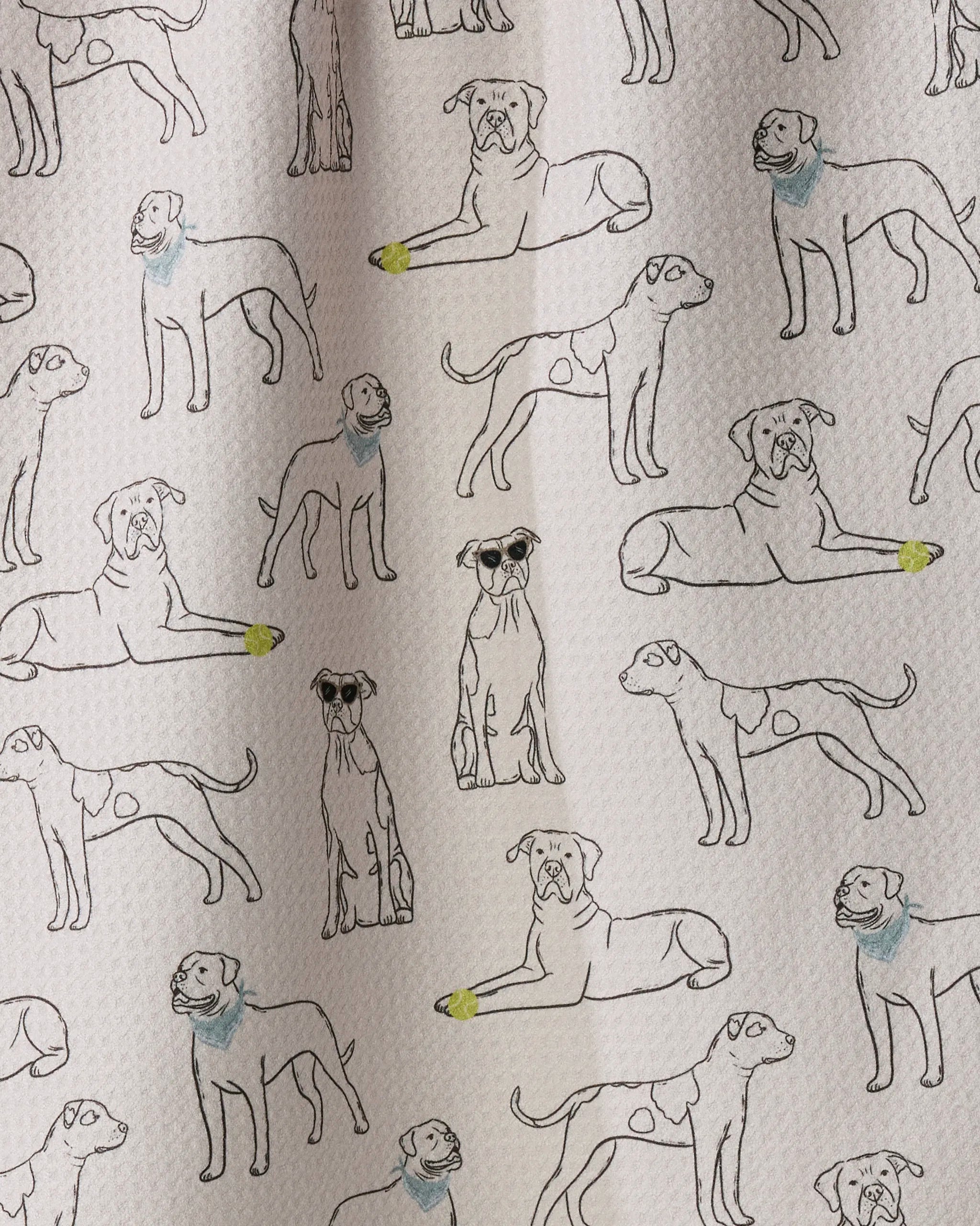 Geometry’s “Bulldog Buddies” features line drawings of dogs in various poses printed on a white textured fabric, creating a charming and absorbent dish towel. Delightful pops of yellow on the paws and blue on the necks add playful color to this tea towel.