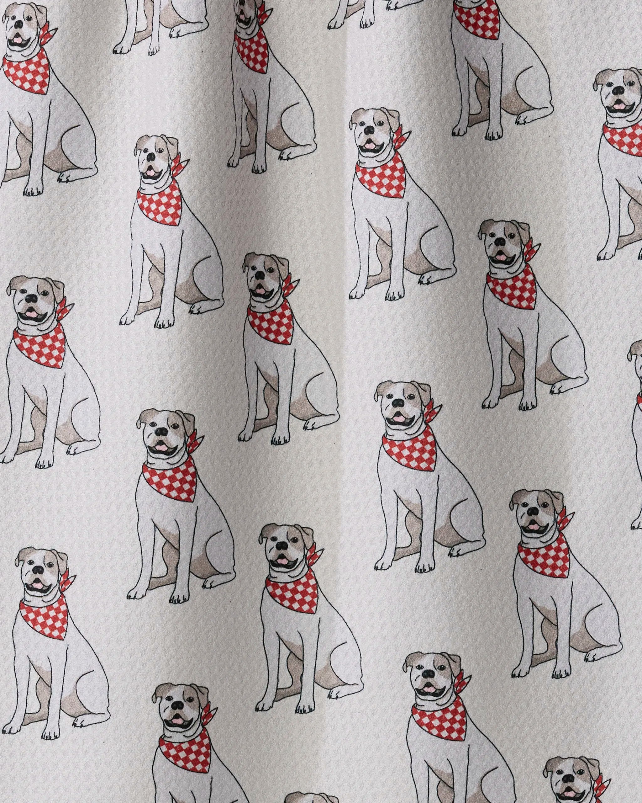 Sure! Here’s a rewritten sentence using your product data: The “Bulldog Club” tea towel from Geometry features a repeating pattern of cartoon bulldogs wearing red and white checkered bandanas on a light, textured background, and is perfect for quick-drying thanks to its recycled material construction.