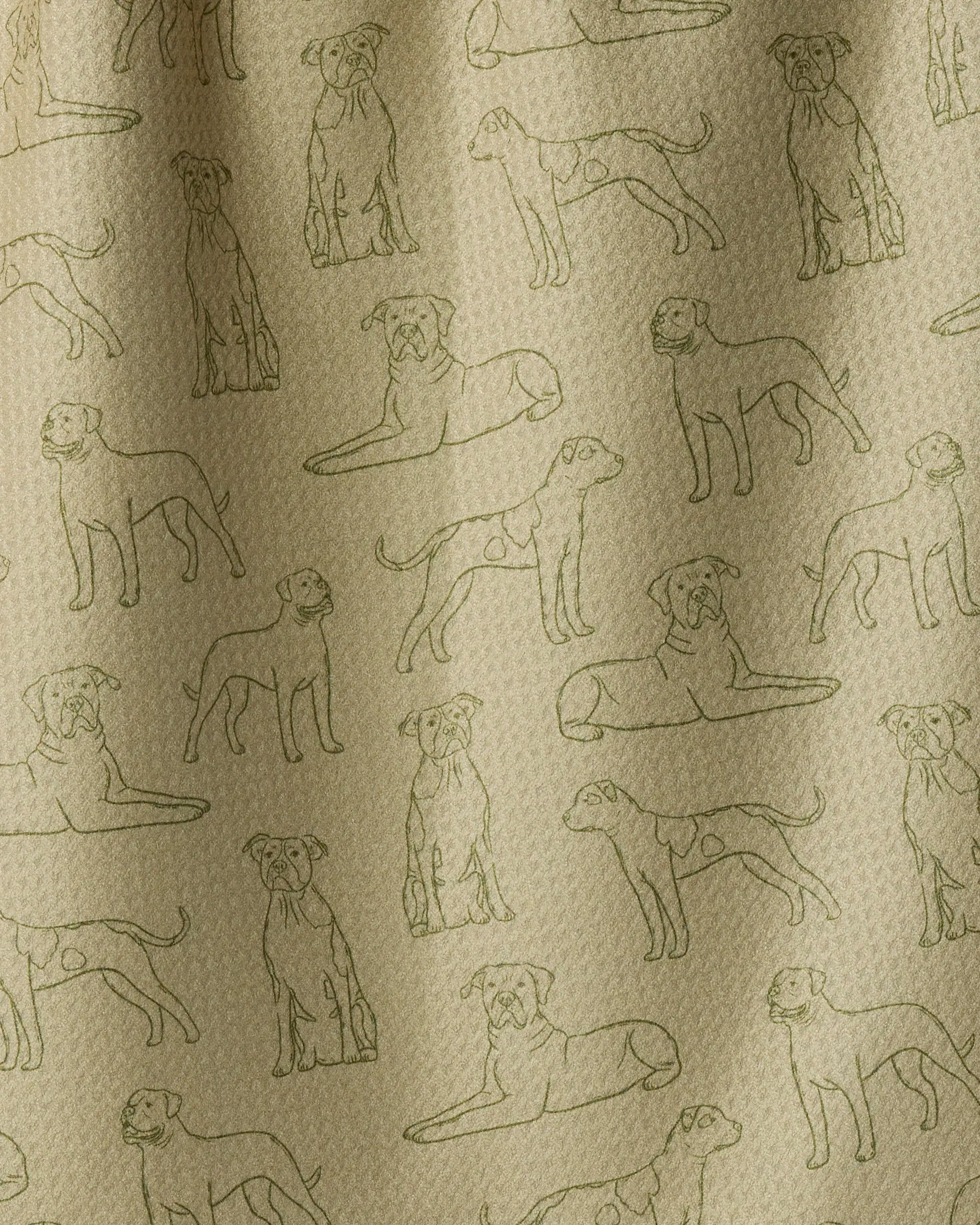 Geometry’s “Bulldog Pups” tea towel features a beige fabric adorned with a repeating line-drawn bulldog pattern, capturing the pups in various poses—sitting, standing, and lying down. Subtle shadows add a touch of texture to the design, making this eco-friendly tea towel a charming and sustainable choice for any kitchen.