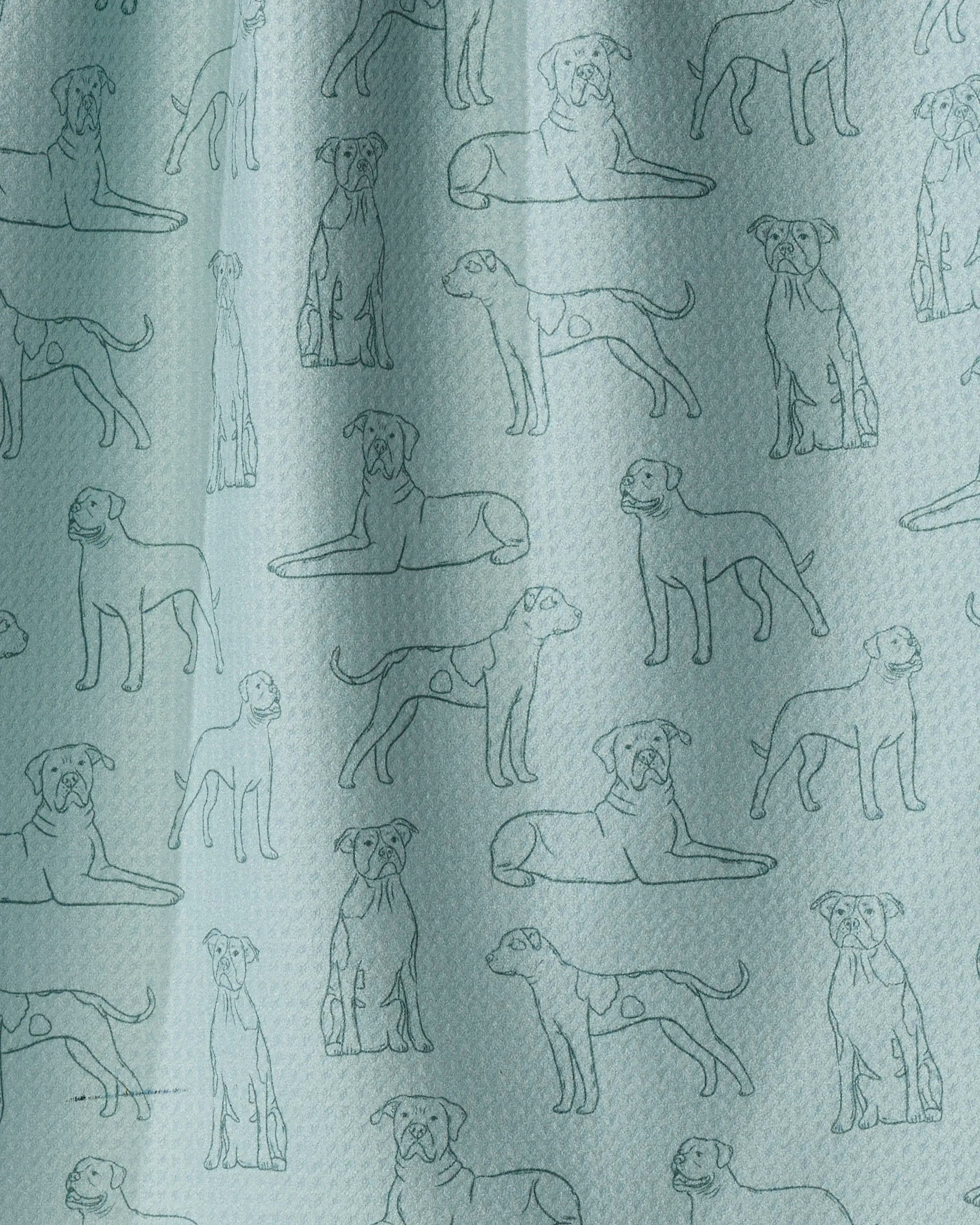 Geometry’s “Bulldog Pups” tea towel features a light blue, eco-friendly fabric adorned with a repeating pattern of line-drawn bulldog puppies in various poses—sitting, standing, and lying down. Outlined in a darker blue for contrast, this charming tea towel makes a delightful addition to any kitchen.