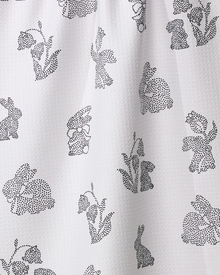 The Geometry Bunny Dots quick-drying towel features a white textured fabric with small black dotted bunny outlines in various poses, creating a playful, evenly scattered design perfect for your kitchen or tea towel collection.