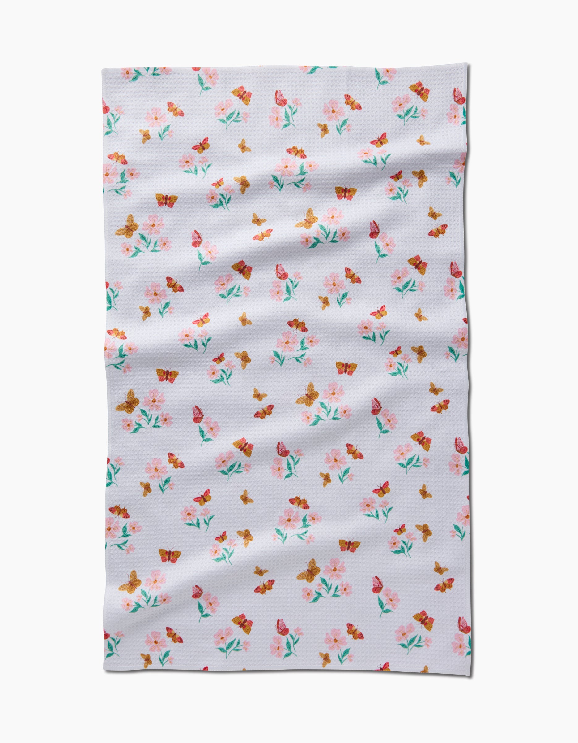 The Butterfly Garden tea towel by Danelys Sidron features pink and orange flowers, green stems, and brown butterflies on white Geoweave™ fabric for durability.