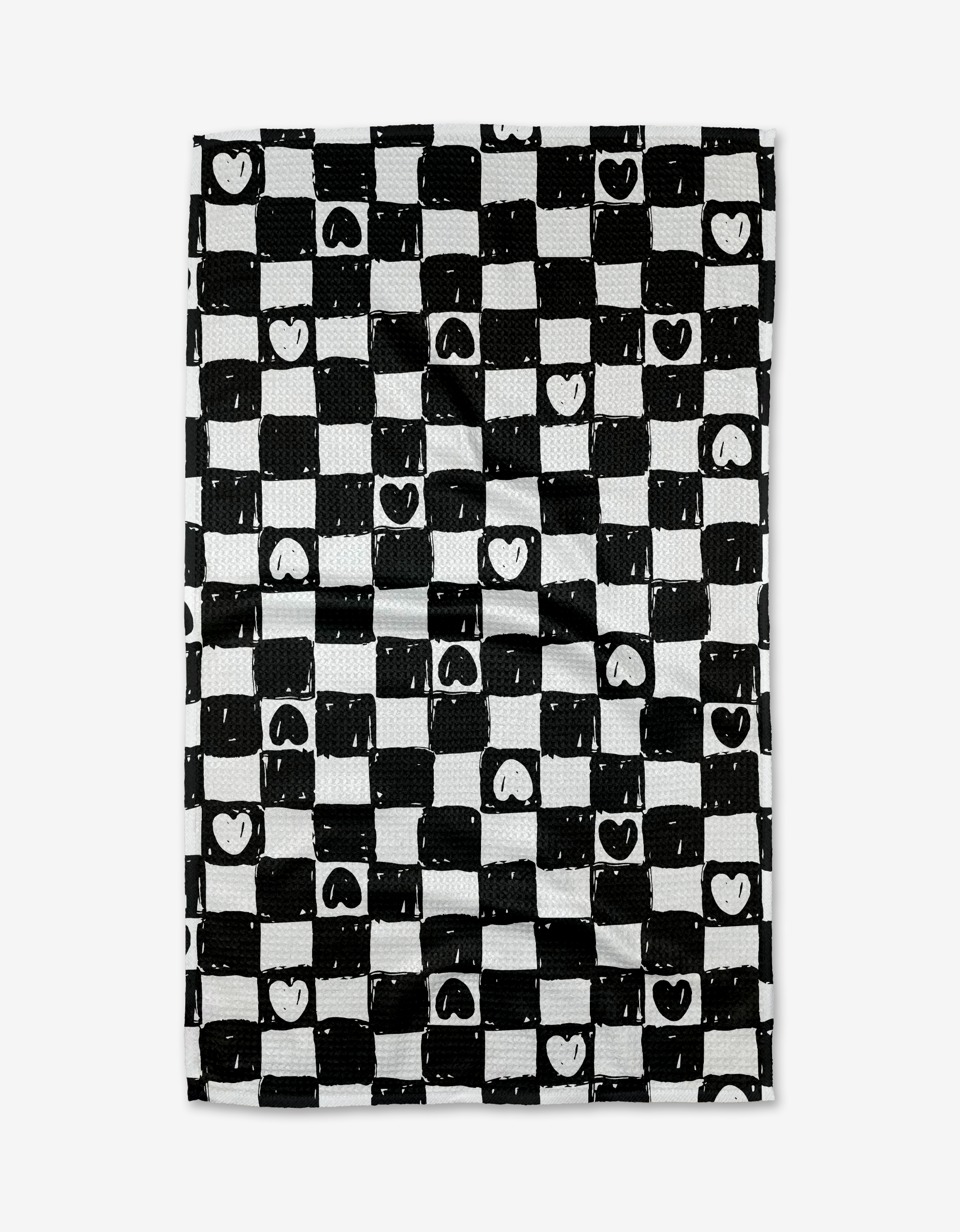 Checkered Hearts by Hufton Studio is a rectangular tea towel featuring a black and white checkerboard design with heart-accented squares, crafted from ultra-absorbent recycled materials for style and sustainability.