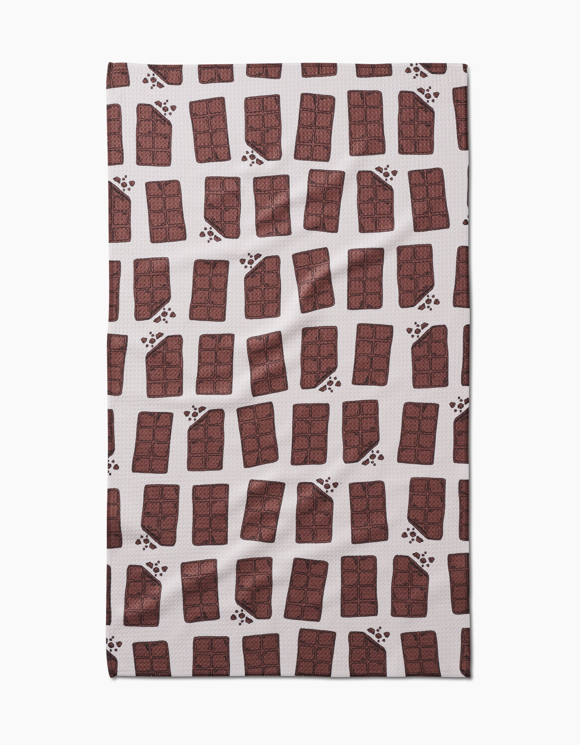The Chocolate Everything tea towel by Amy Droubay features a white Geoweave fabric with a repeating pattern of illustrated chocolate bars and scattered brown paw prints.