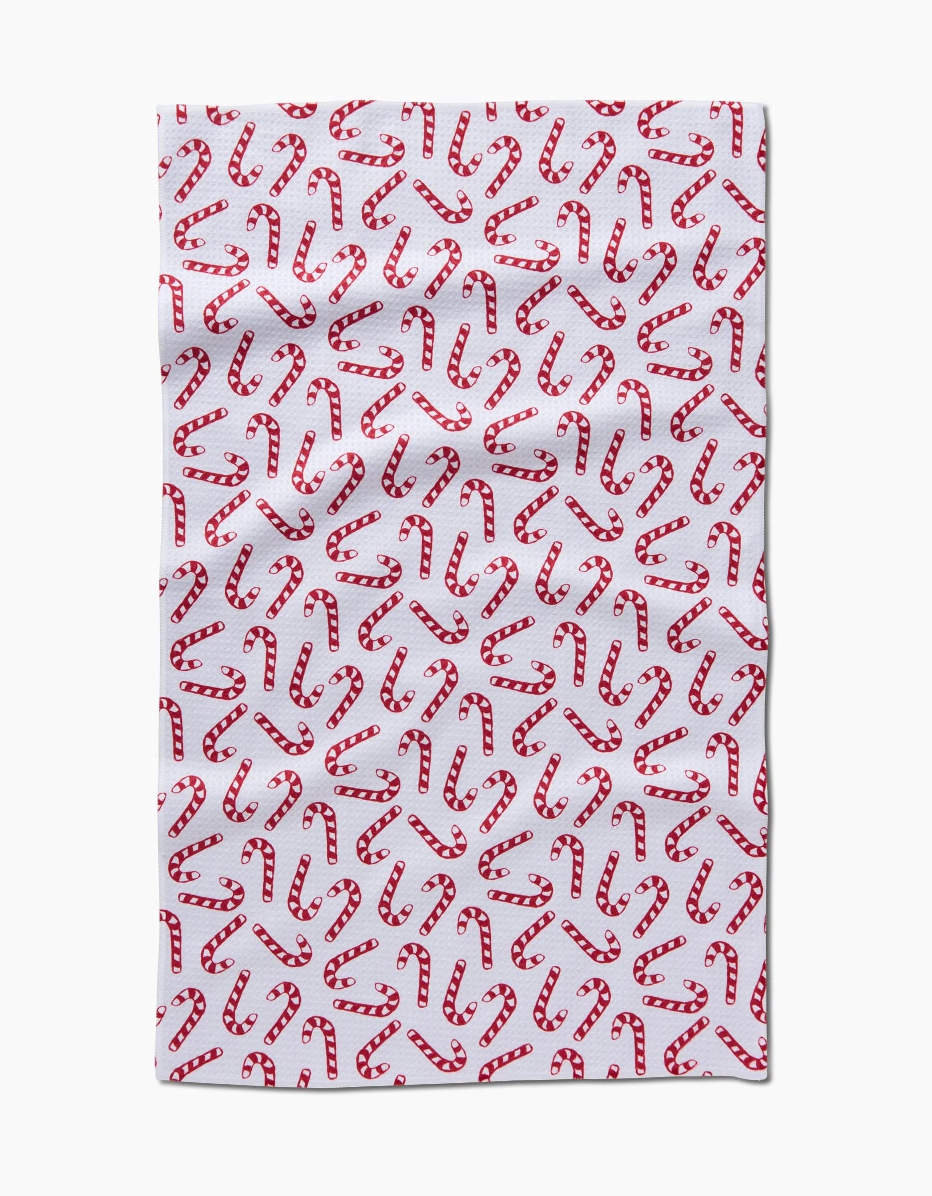The Aubrey Fairchild Christmas Candy Canes tea towel features a pattern of red and white striped candy canes and is made from ultra-absorbent recycled materials.