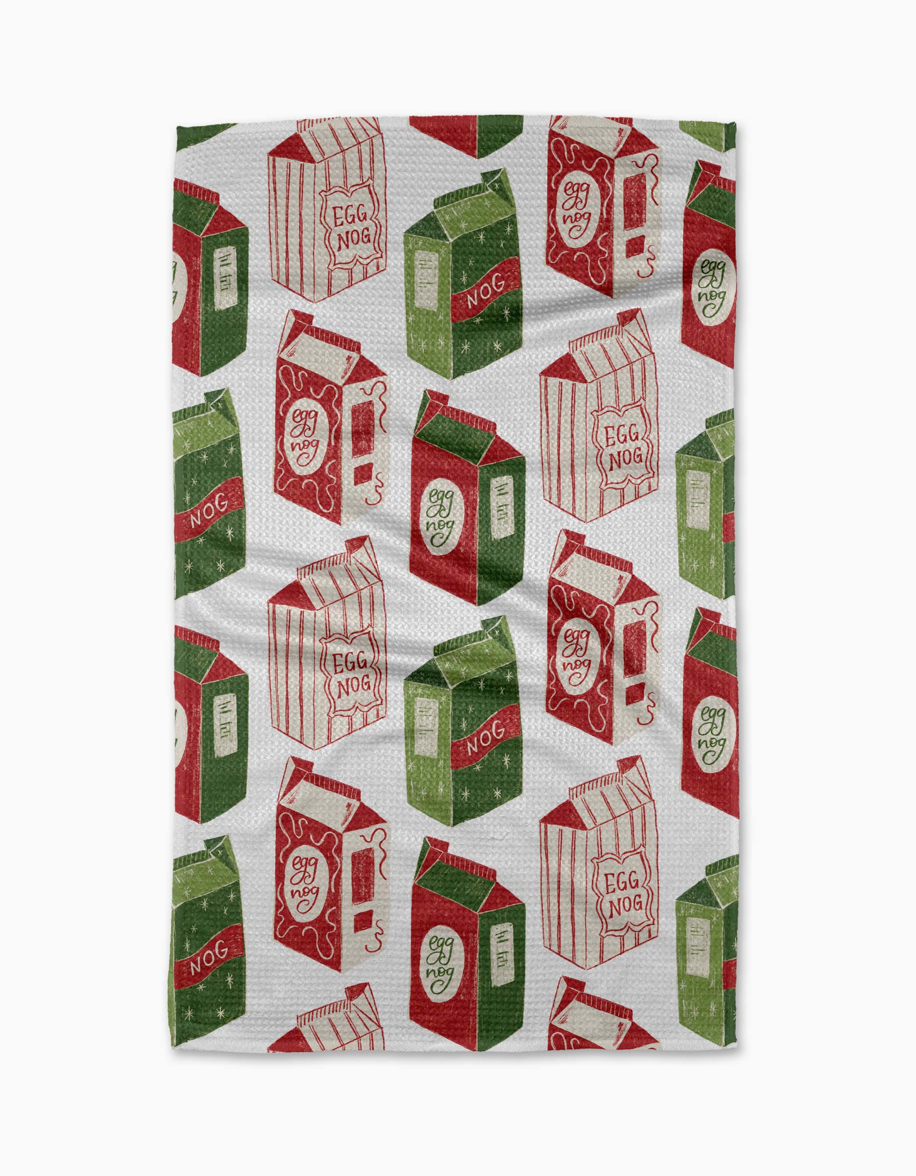 The Aubrey Fairchild “Christmas Eggnog” tea towel showcases a festive, playful design of red and green vintage-style eggnog cartons in various angles and sizes, all set against a white background.