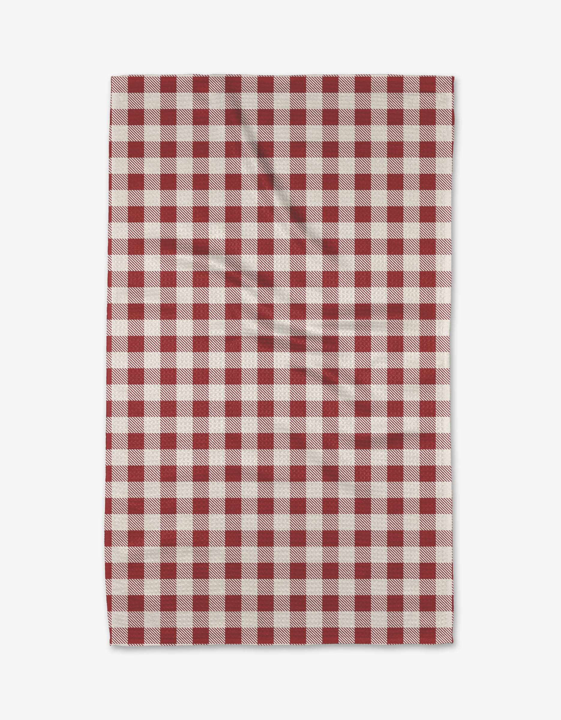 The Aubrey Fairchild Christmas Gingham Red rectangular tea towel features a red and white checkered pattern, laid flat with subtle folds visible.