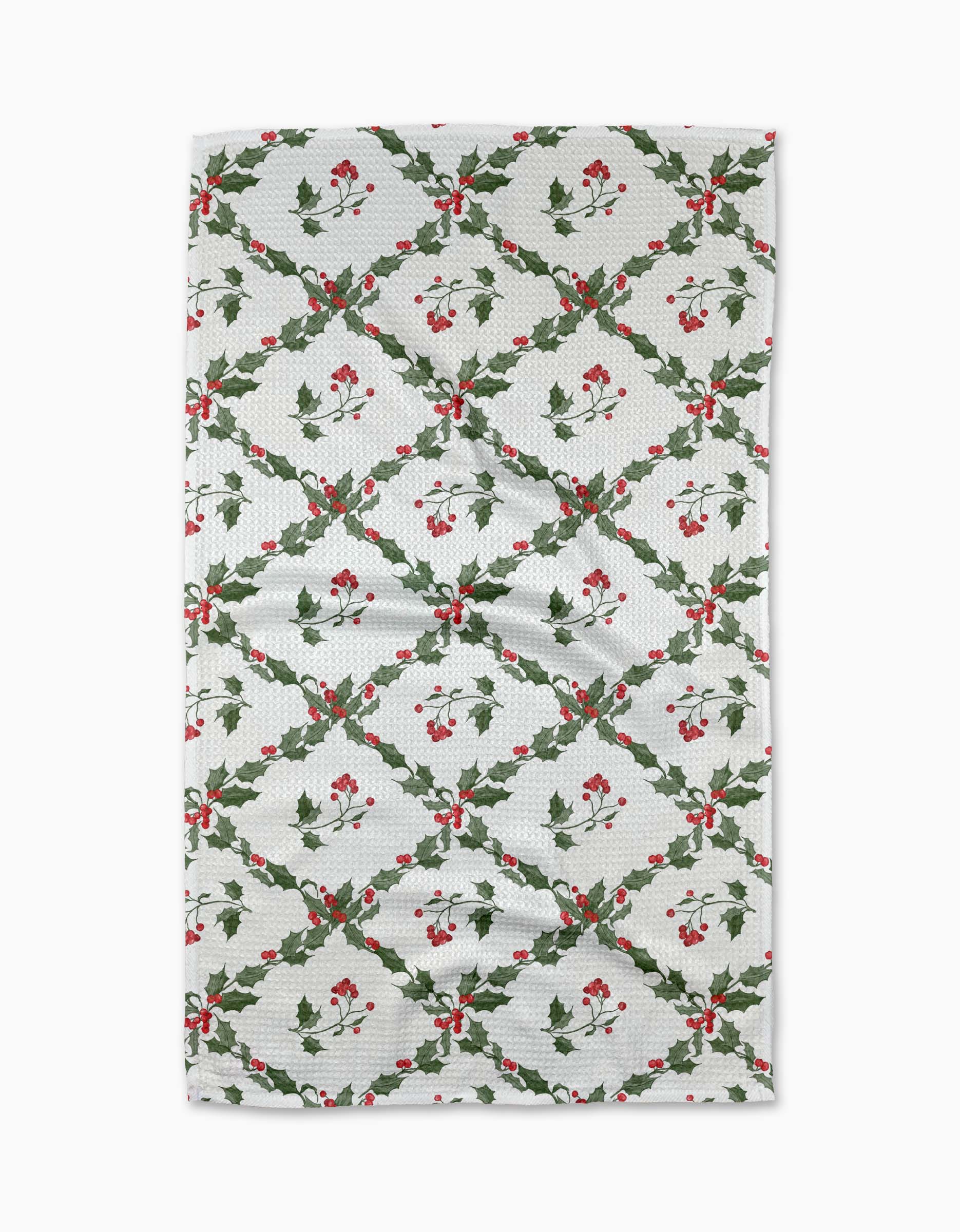 The Aubrey Fairchild Christmas Lattice tea towel features a festive green lattice with holly leaves and red berries, brightening your kitchen for the holidays. Made from recycled materials, it's an eco-friendly choice.