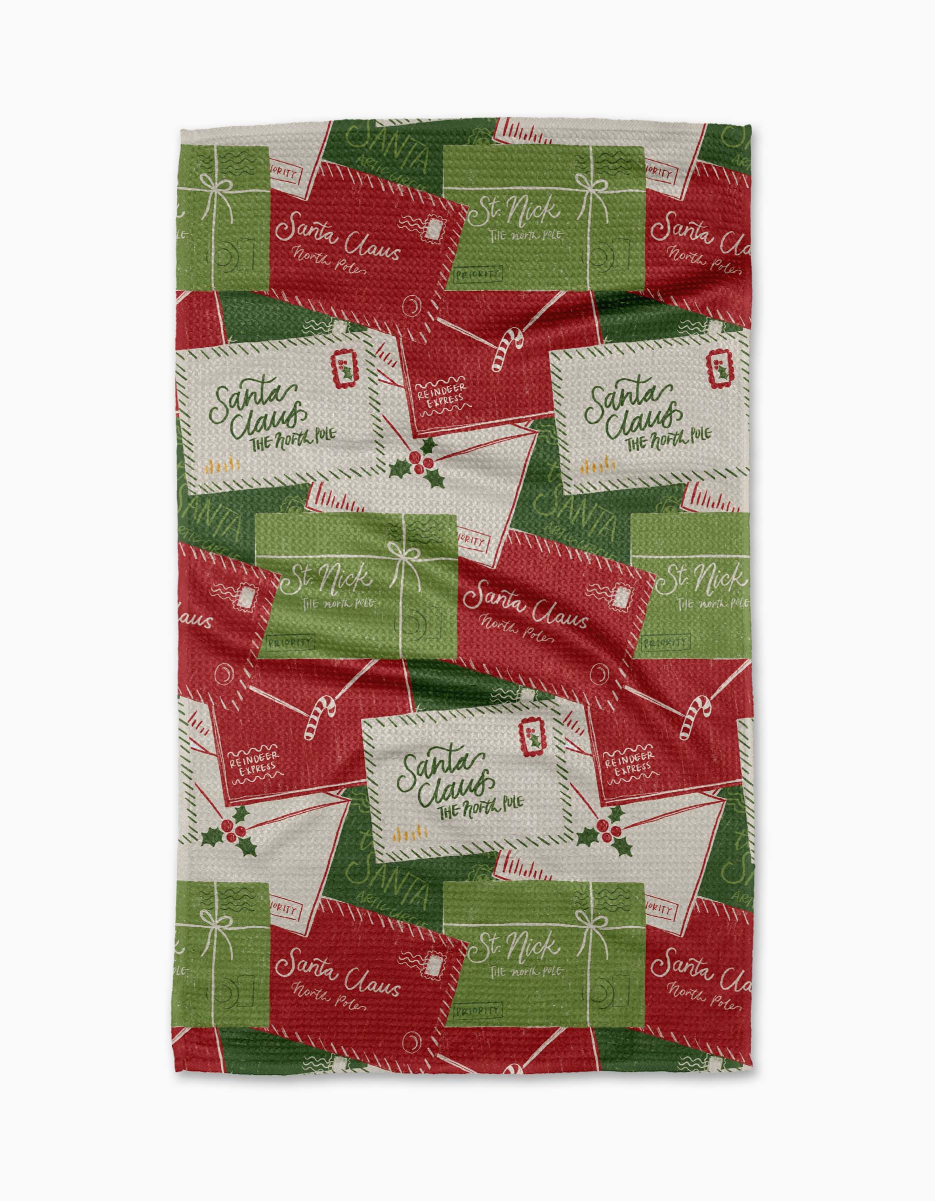 The "Christmas Letter Pile" tea towel by Aubrey Fairchild features red, green, and white holiday envelopes with cheerful messages, holly, and stamps. Made from quick-drying recycled materials—perfect for festive kitchens.
