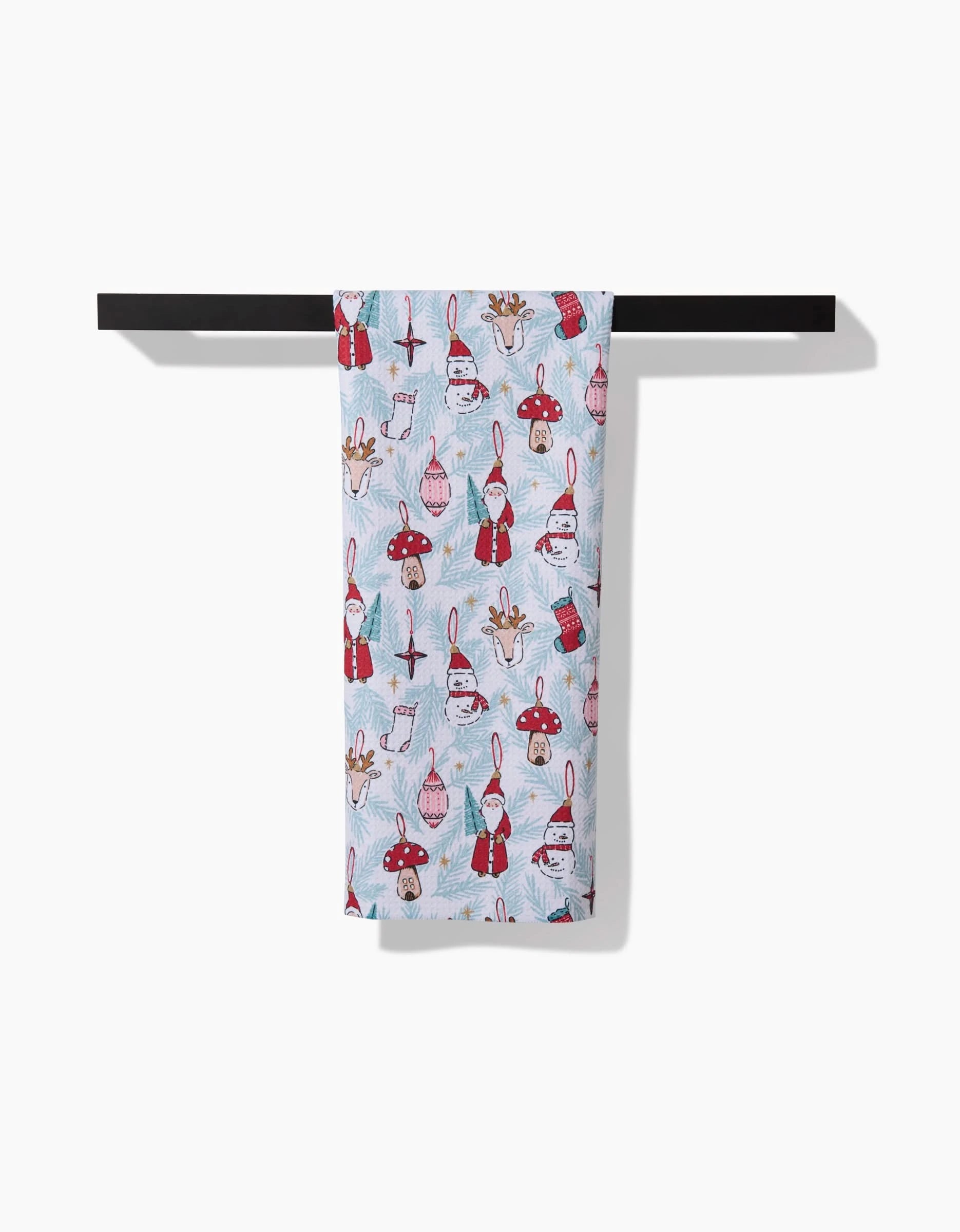 The Hufton Studio Christmas Traditions white tea towel features Santa, reindeer, and ornaments—ideal for bringing festive cheer to your kitchen.