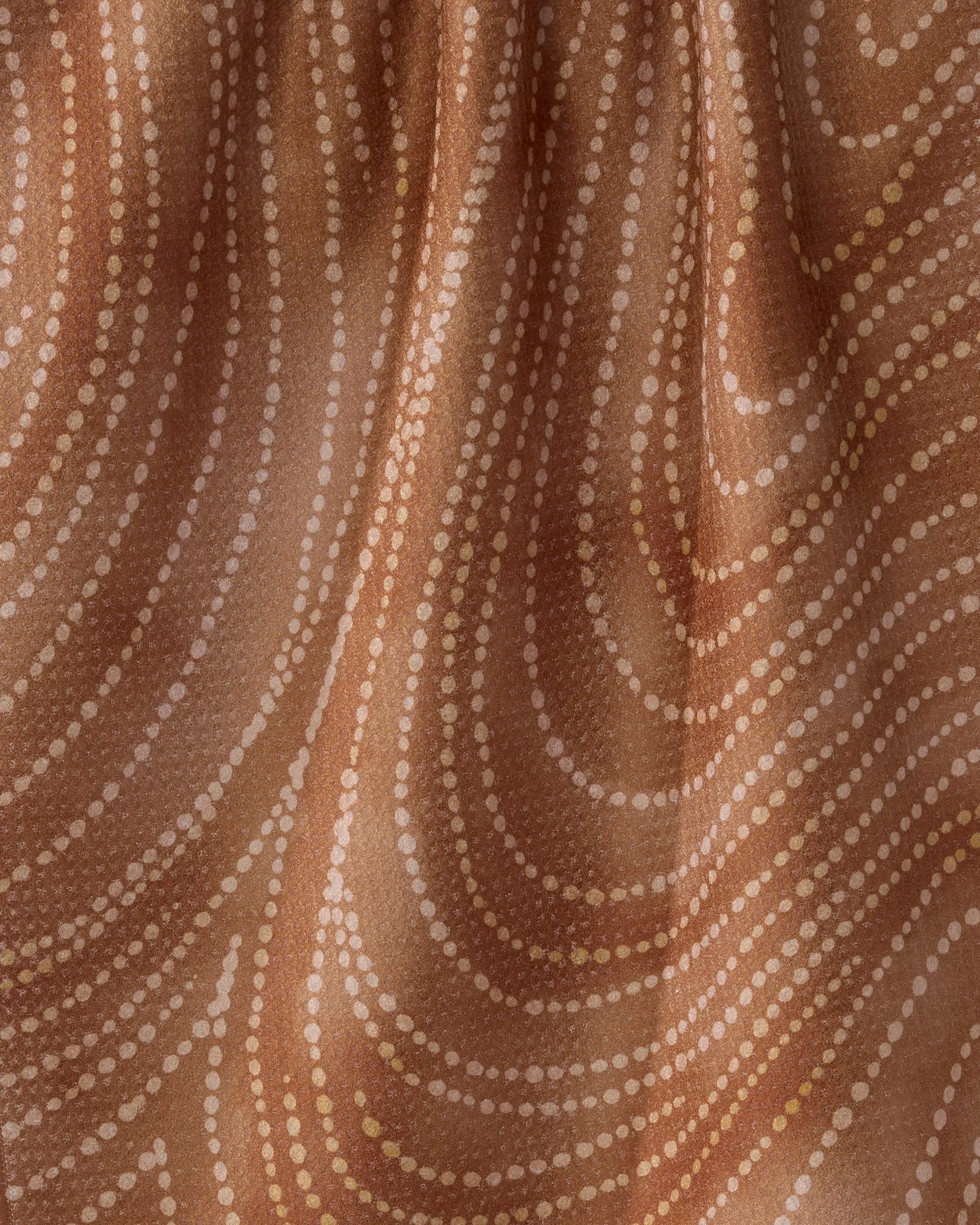 Geometry's Cinnamon Swirl towel features brown fabric with wavy lines of white and light brown dots in a flowing abstract design. Ultra-absorbent and soft, it's crafted from recycled materials for a smooth, eco-friendly touch.