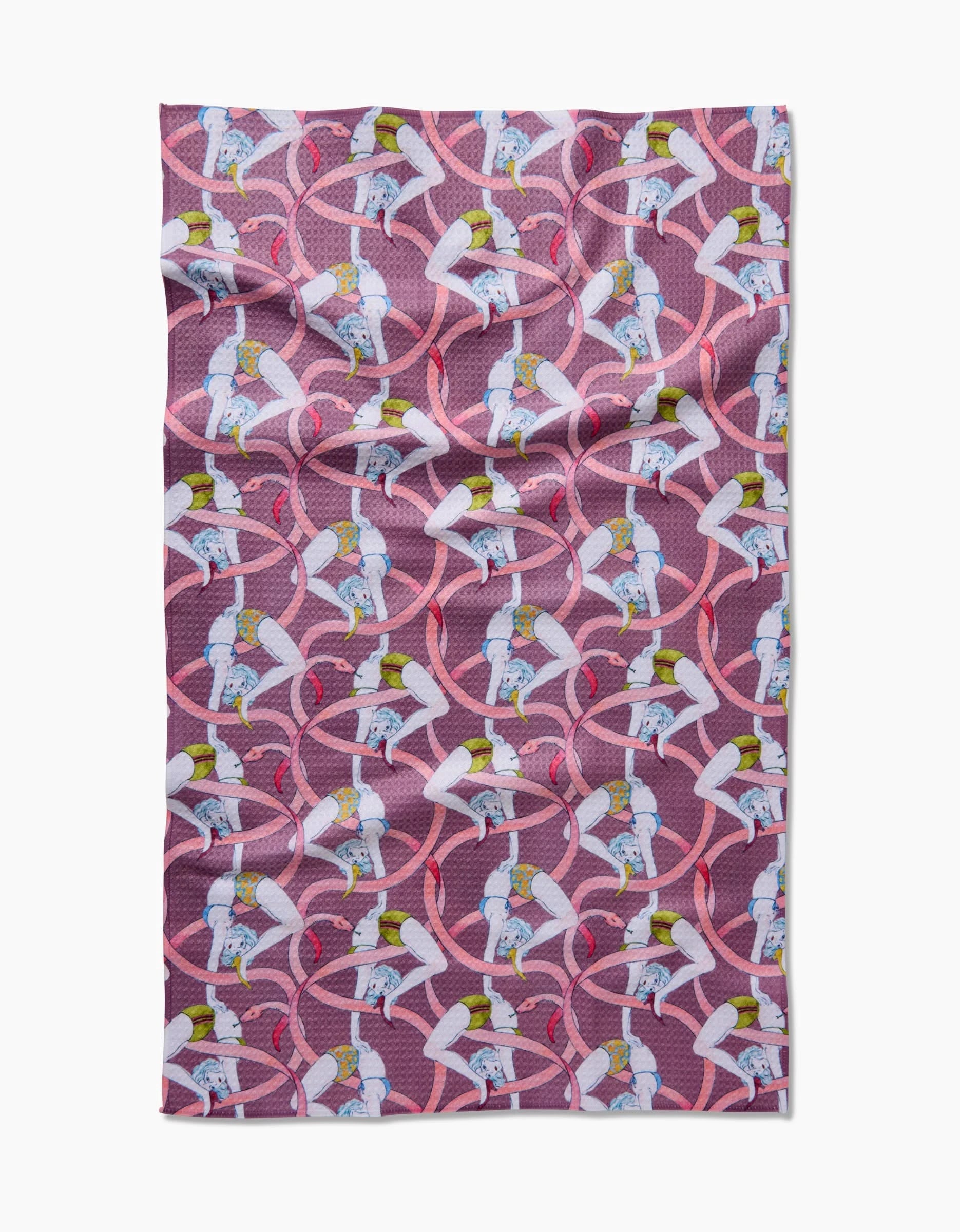 The Circus Geoweave™ blanket by Maayan Alper-Swan features a textured purple design with cartoon ballerina cows in tutus and ballet shoes, set among pink swirling ribbons.