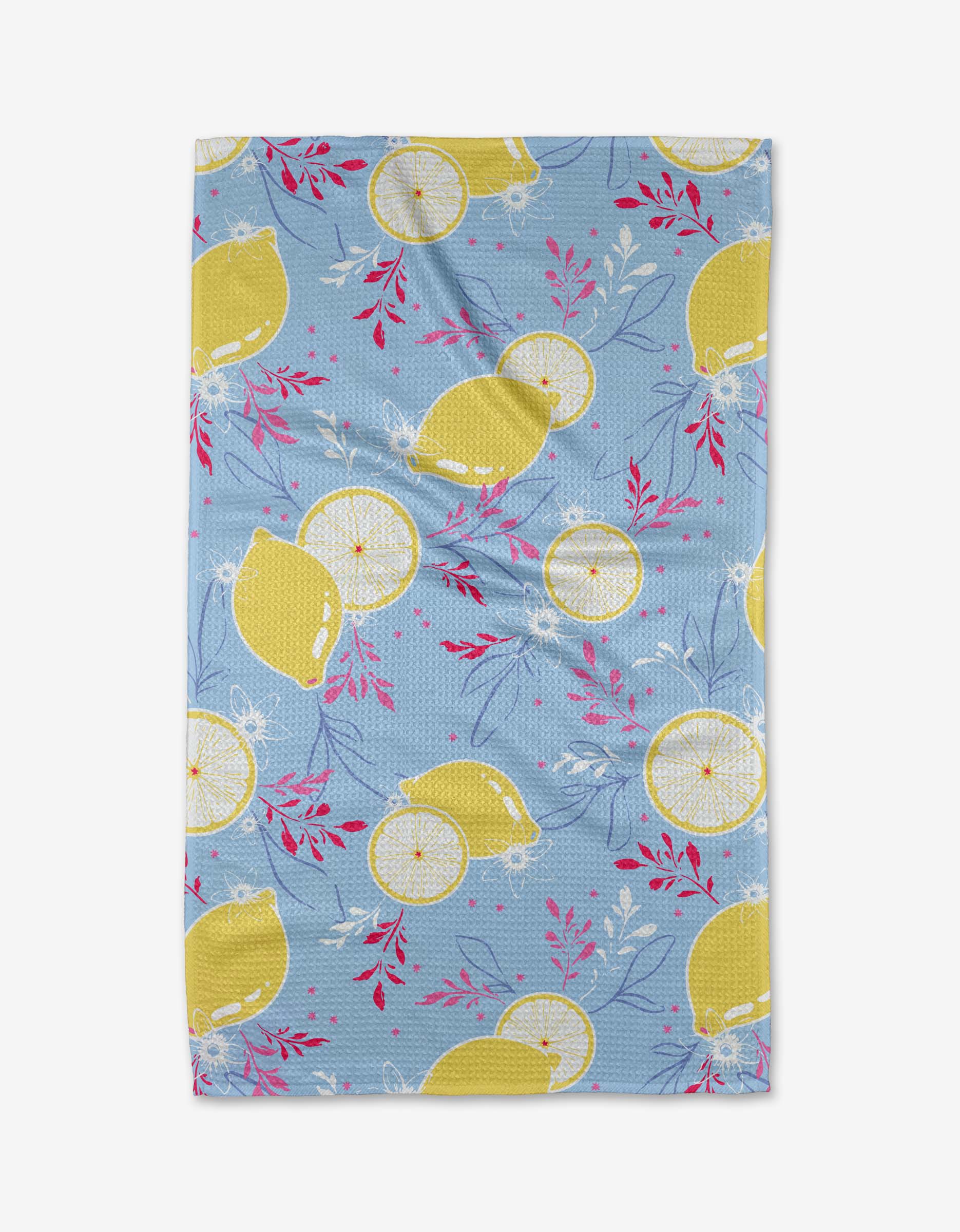 Citrus Bloom by Ashley Celena: a blue tea towel made from recycled materials, showcasing whole lemons, lemon slices, and pink and white leafy branches in a vibrant pattern.