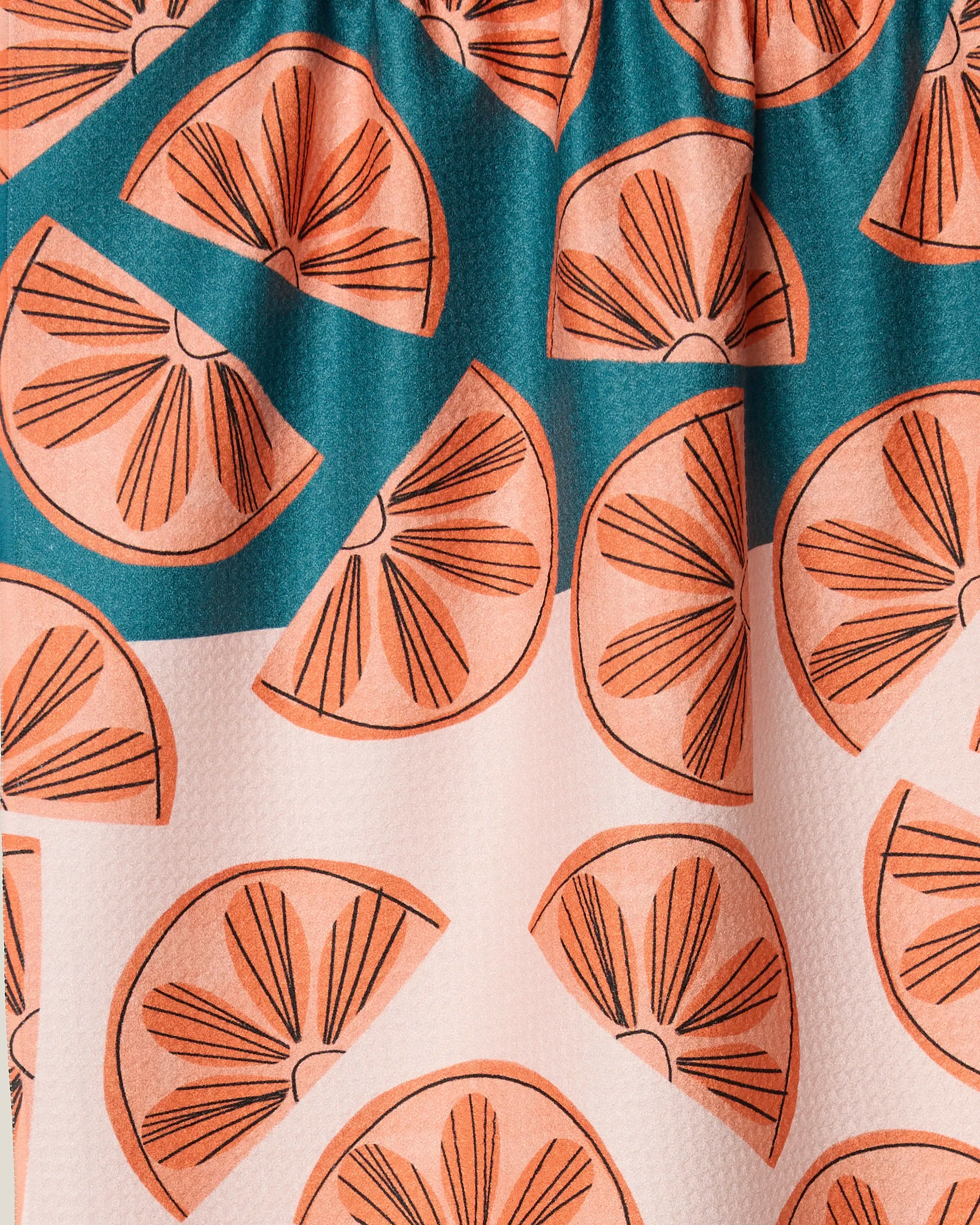 Citrus Slices by Louise Pretzel: A close-up of ultra-absorbent, recycled fabric with an orange and teal stylized citrus pattern—ideal for kitchen tea towels.