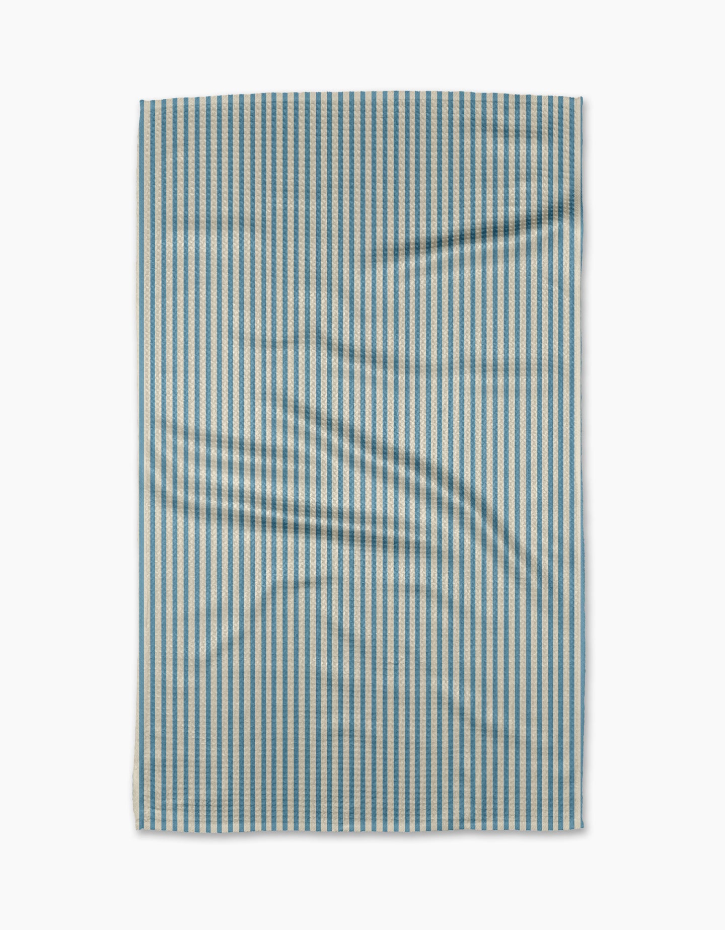 The Clean Slate tea towel by Susan Heid is rectangular, made from recycled materials, with thin blue and white vertical stripes and a slightly wrinkled texture, shown against a white background.